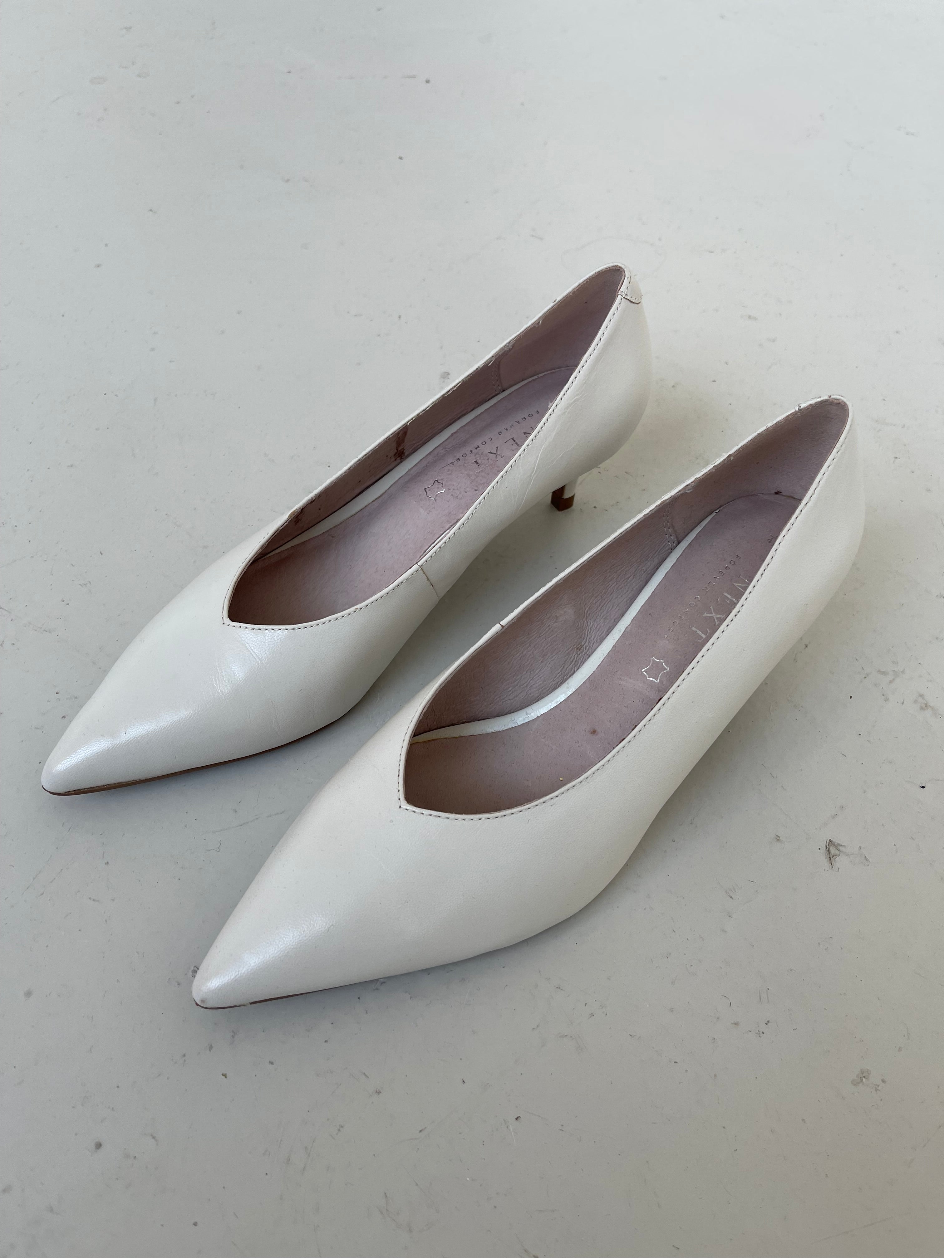 White leather kitten heels