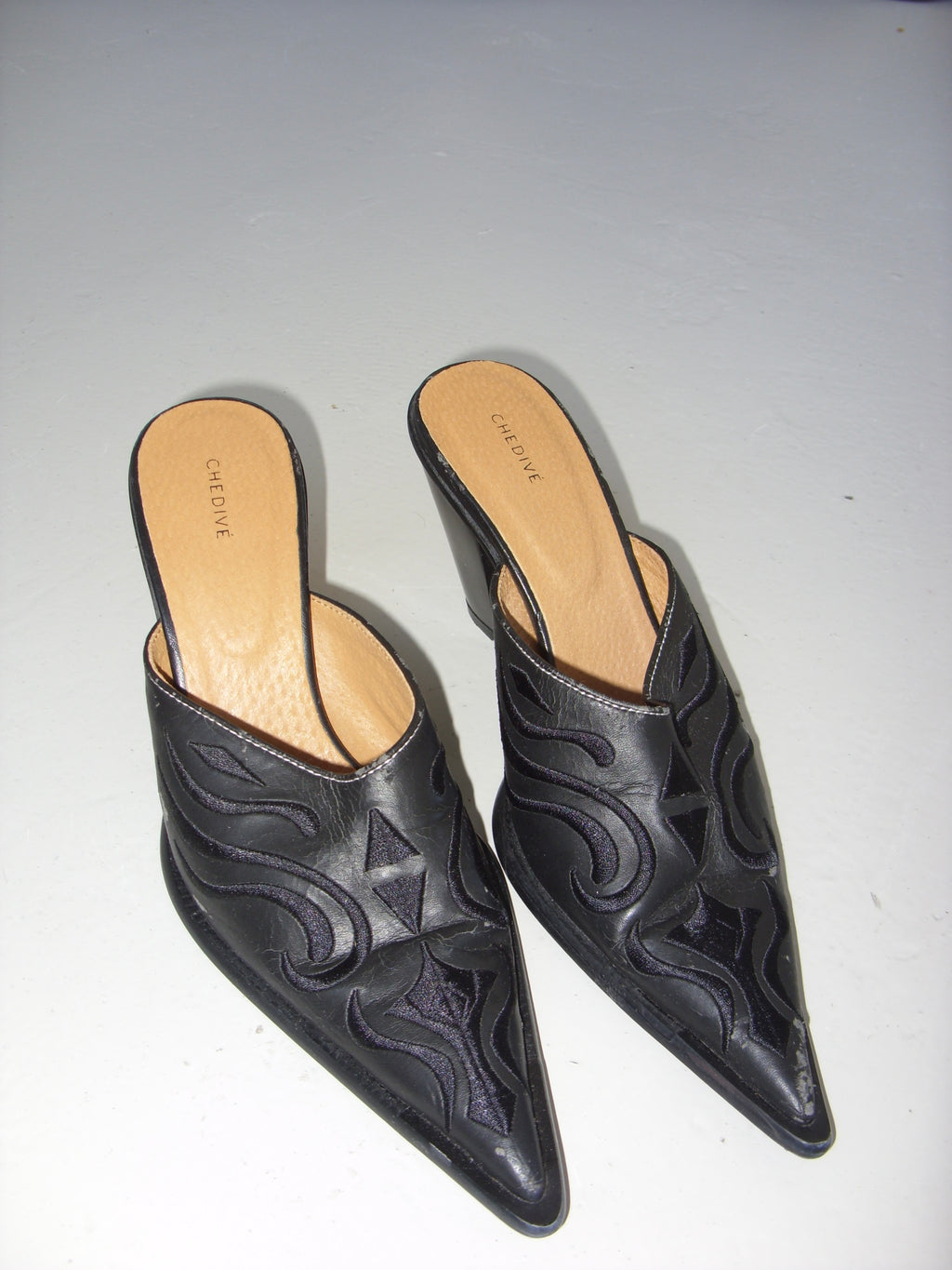 Black western style mules with embroidery detail