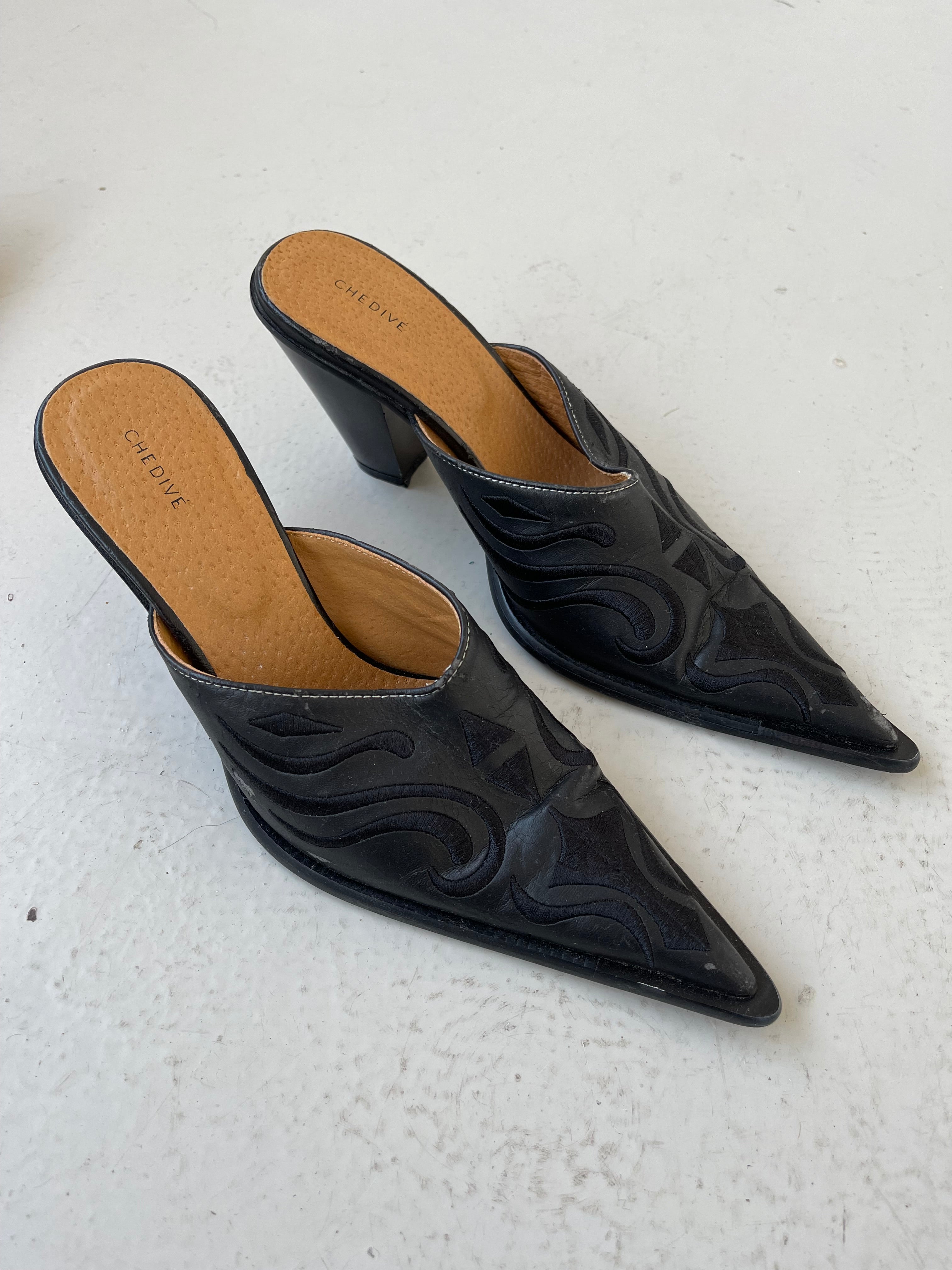 Black western style mules with embroidery detail