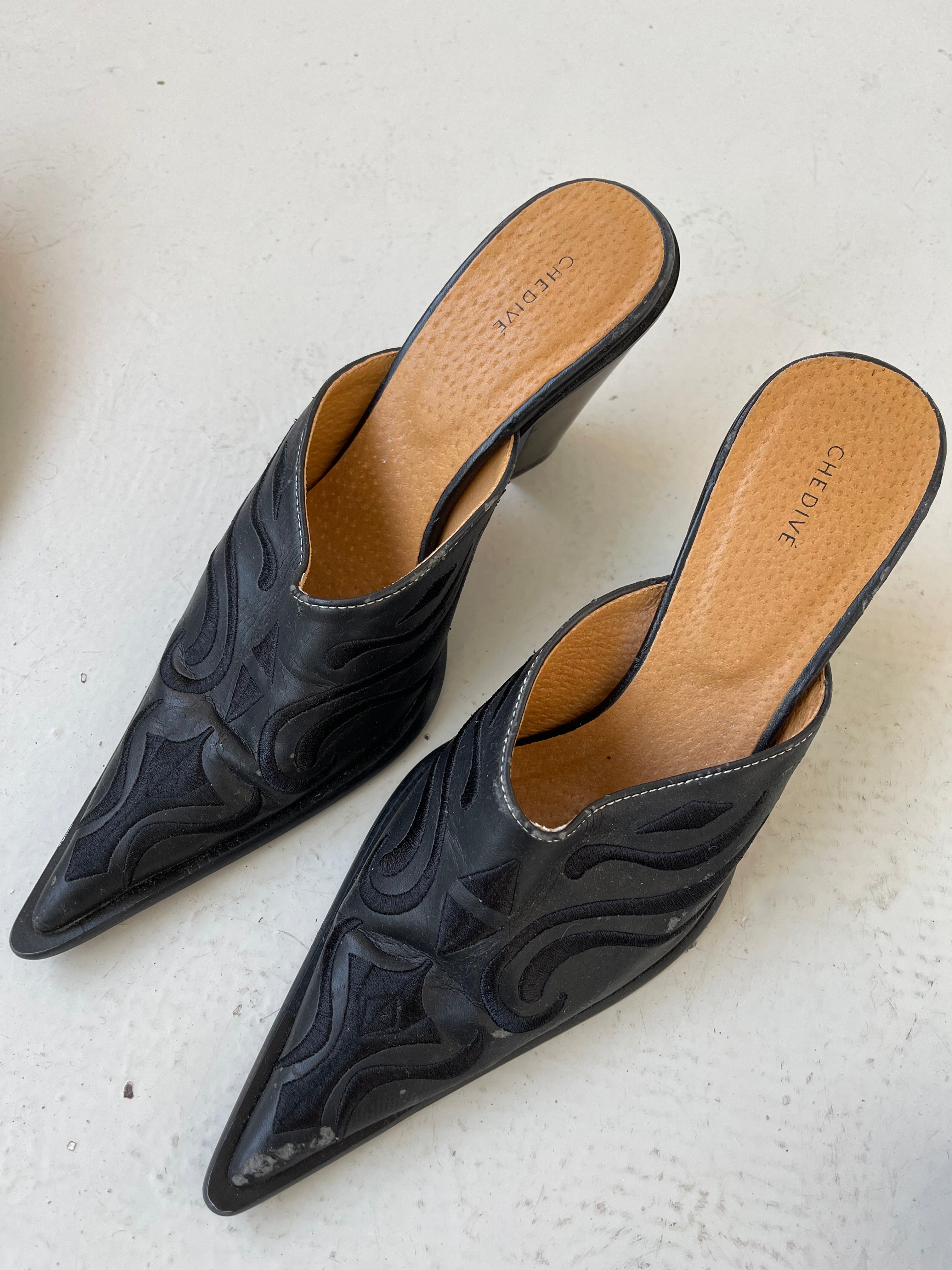 Black western style mules with embroidery detail
