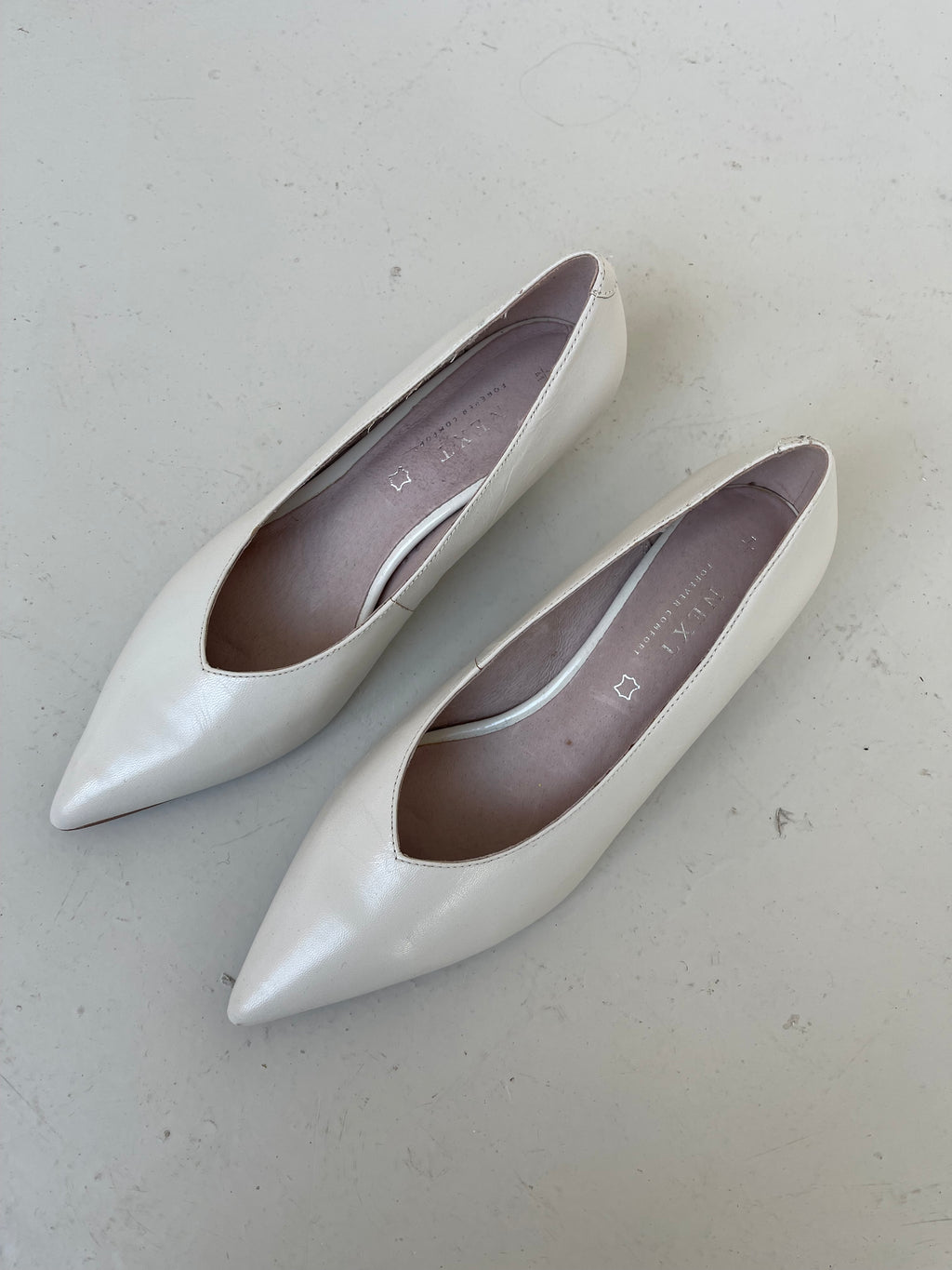 White leather kitten heels