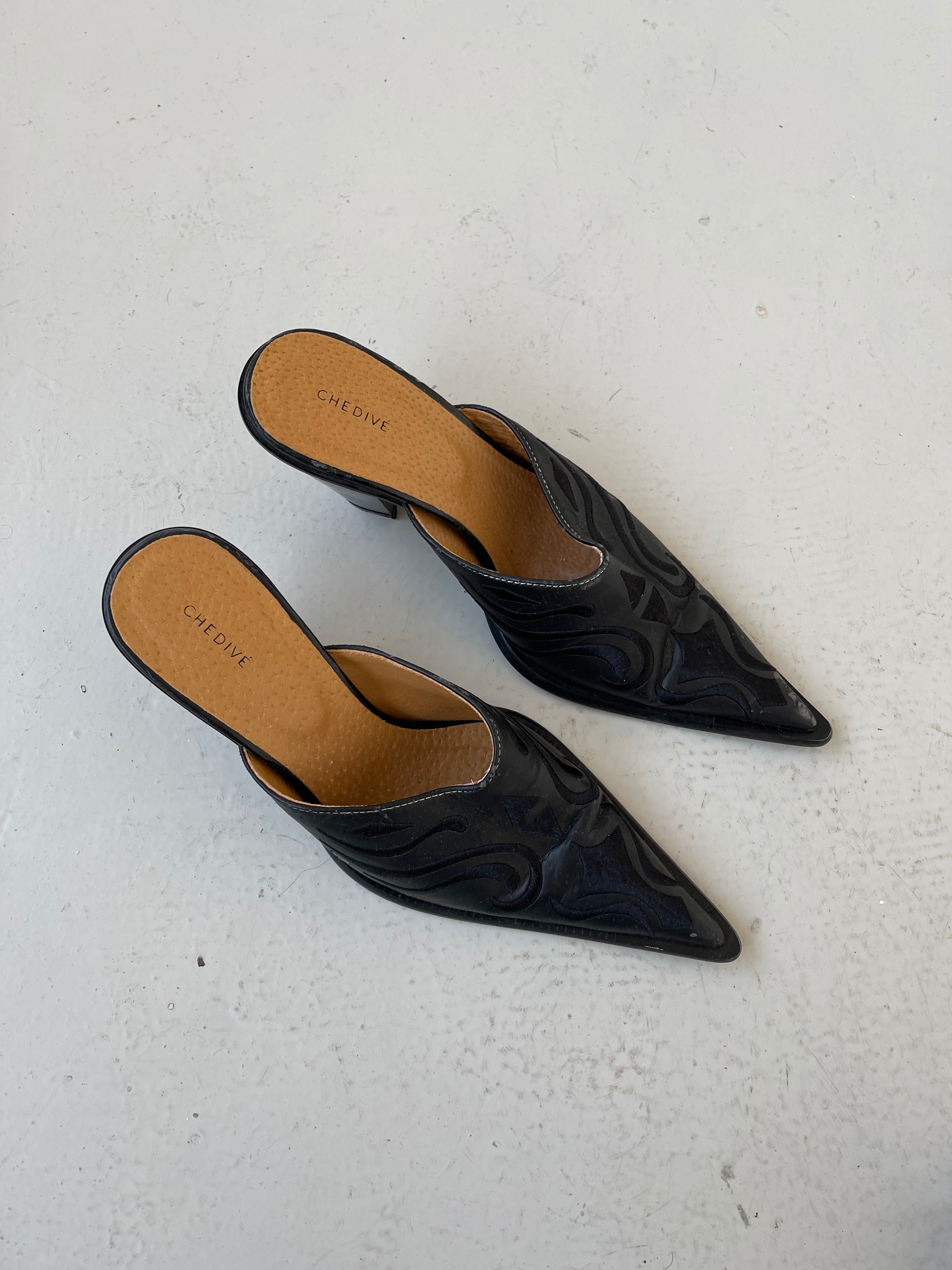 Black western style mules with embroidery detail