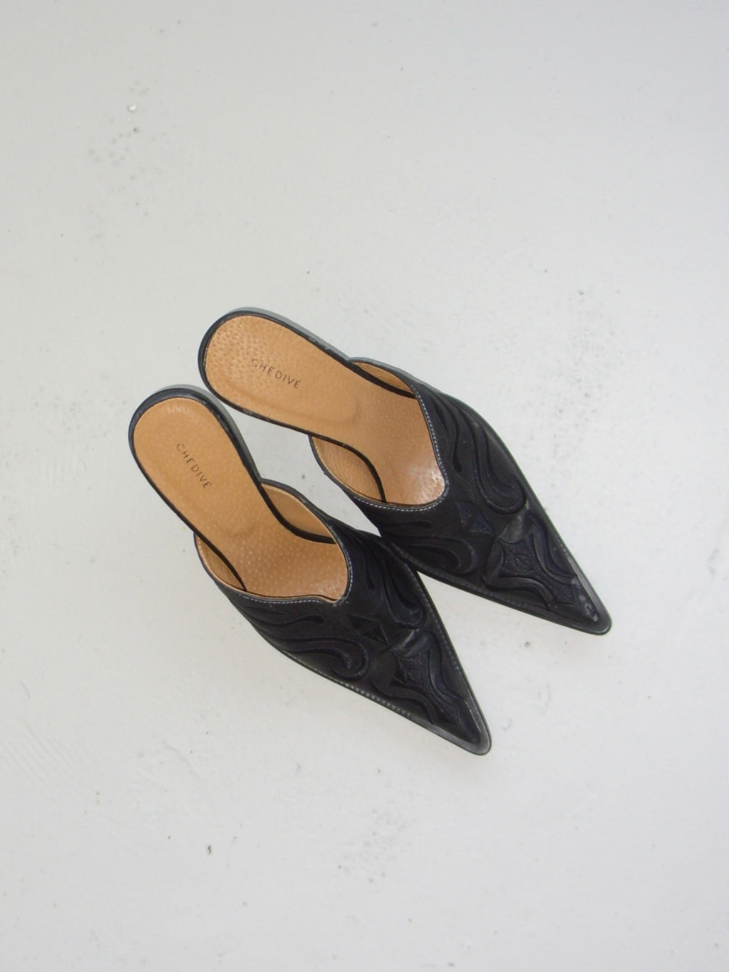 Black western style mules with embroidery detail