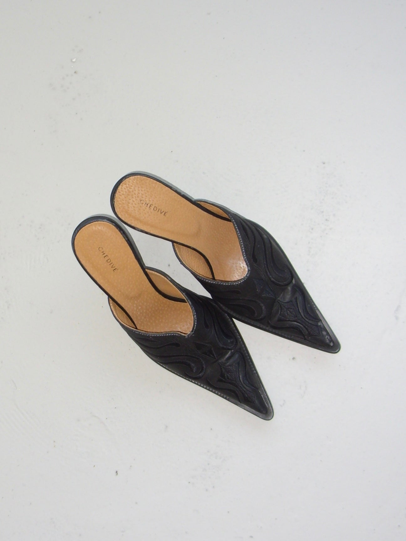 Black western style mules with embroidery detail