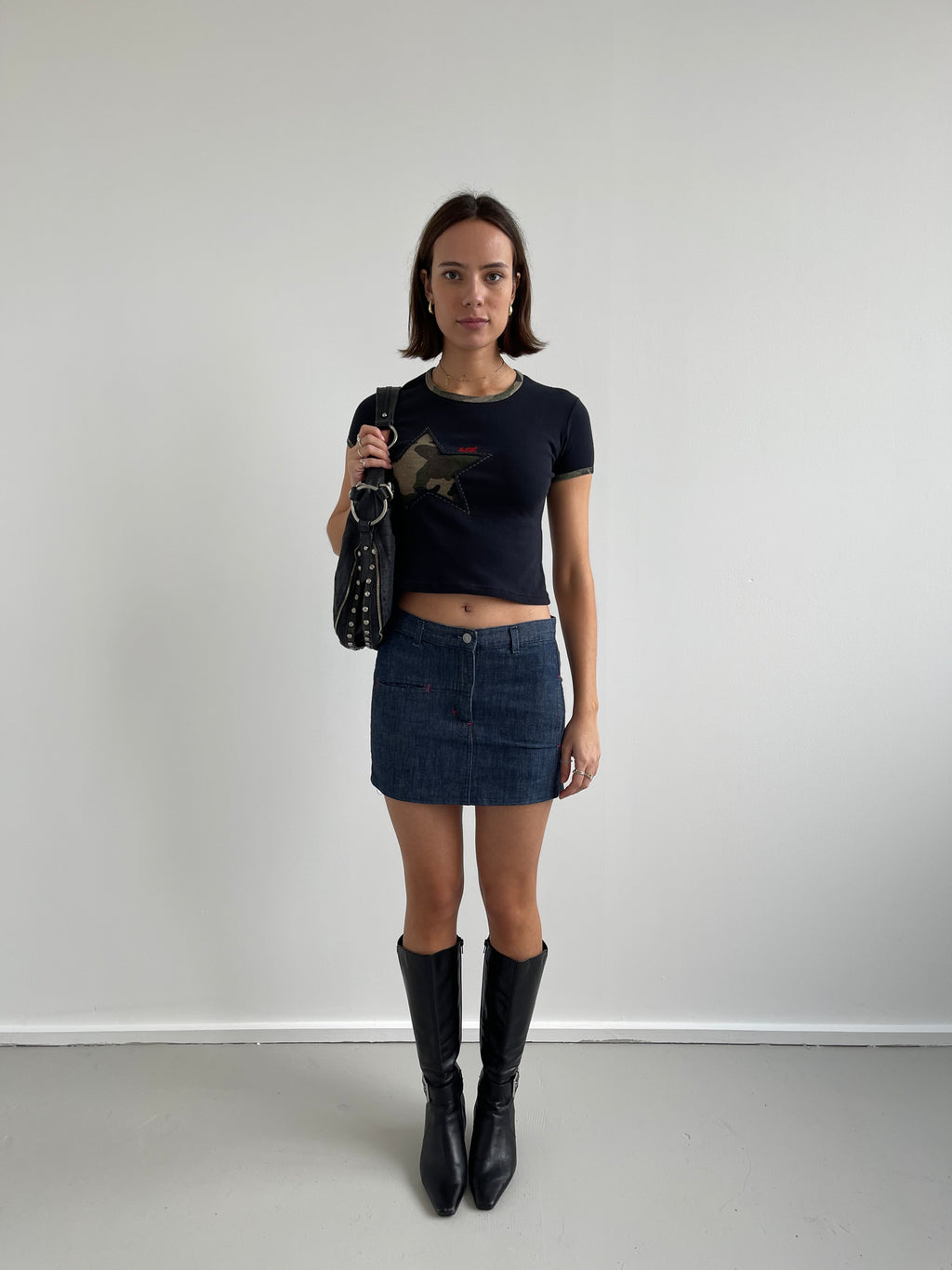 Denim mini skirt with pink top stitching detail