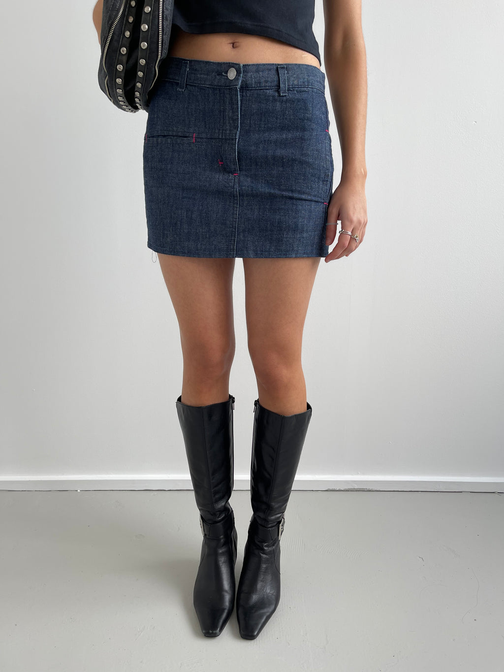 Denim mini skirt with pink top stitching detail
