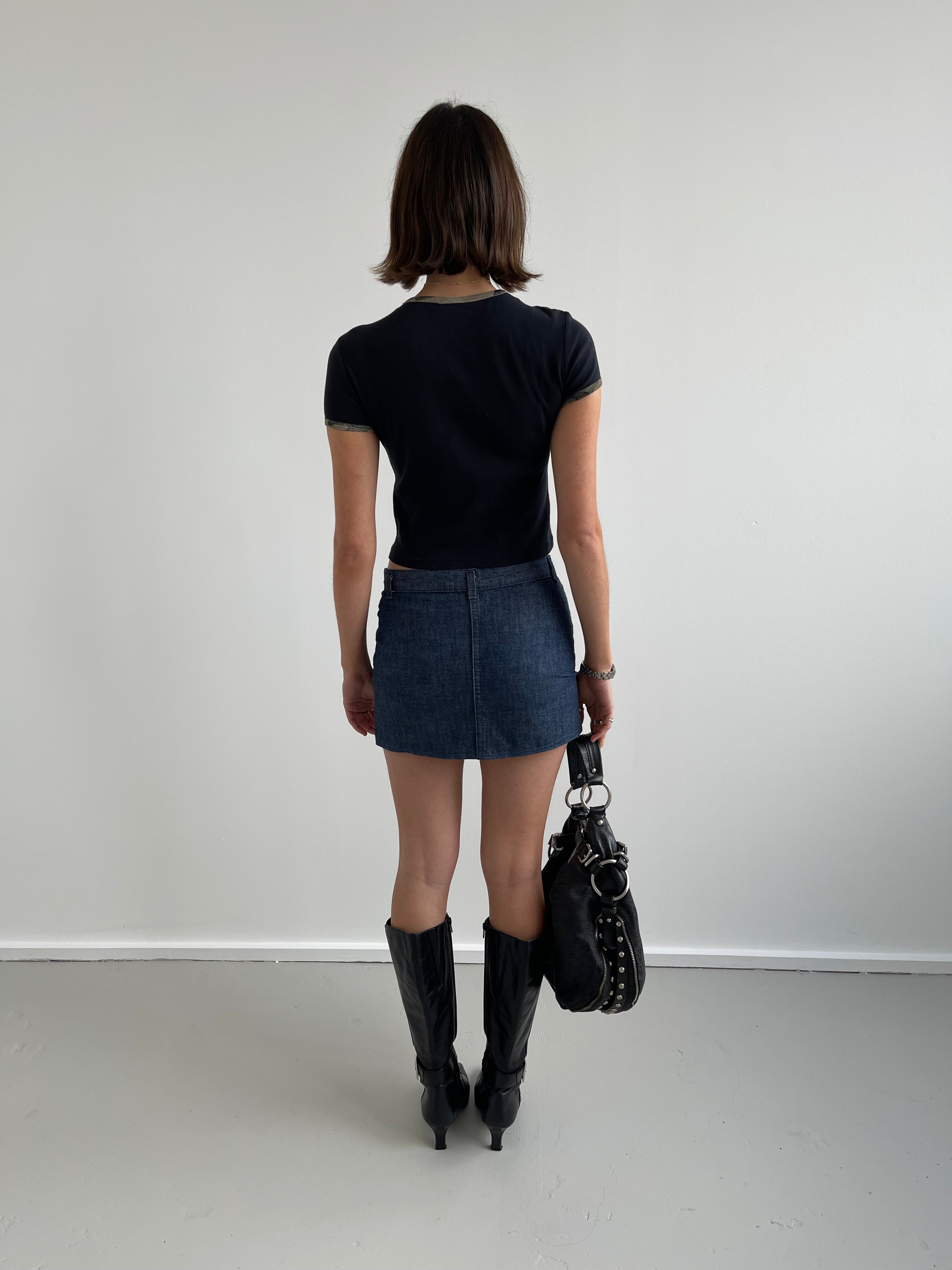 Denim mini skirt with pink top stitching detail
