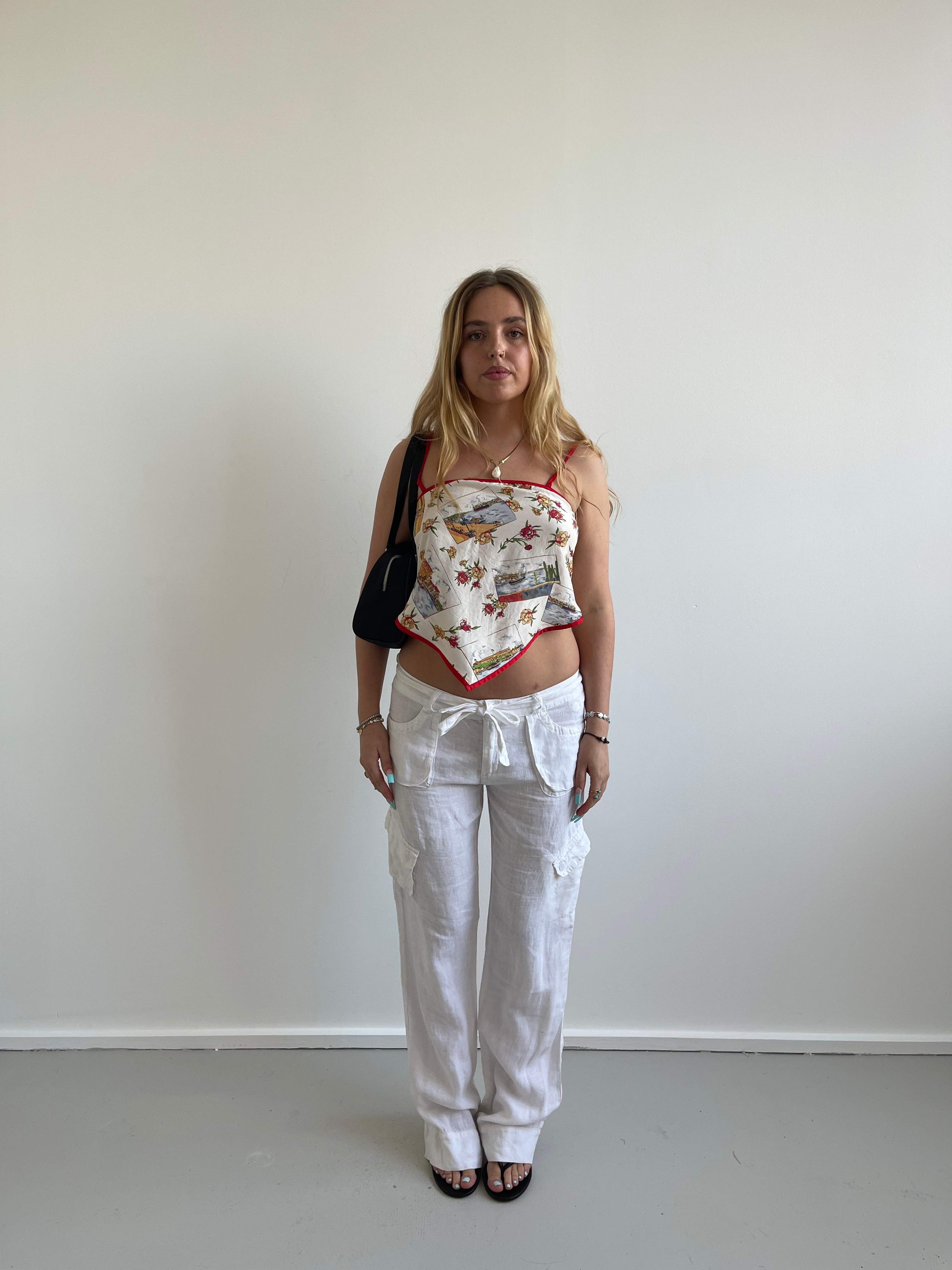 White linen trousers with belt and cargo style pockets