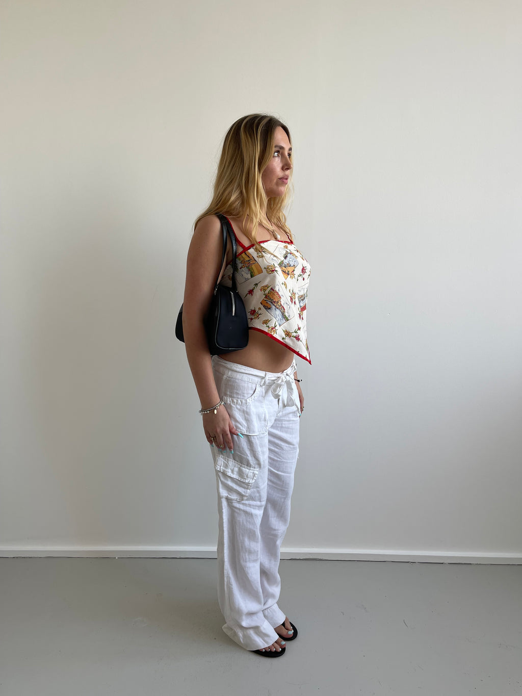 White linen trousers with belt and cargo style pockets