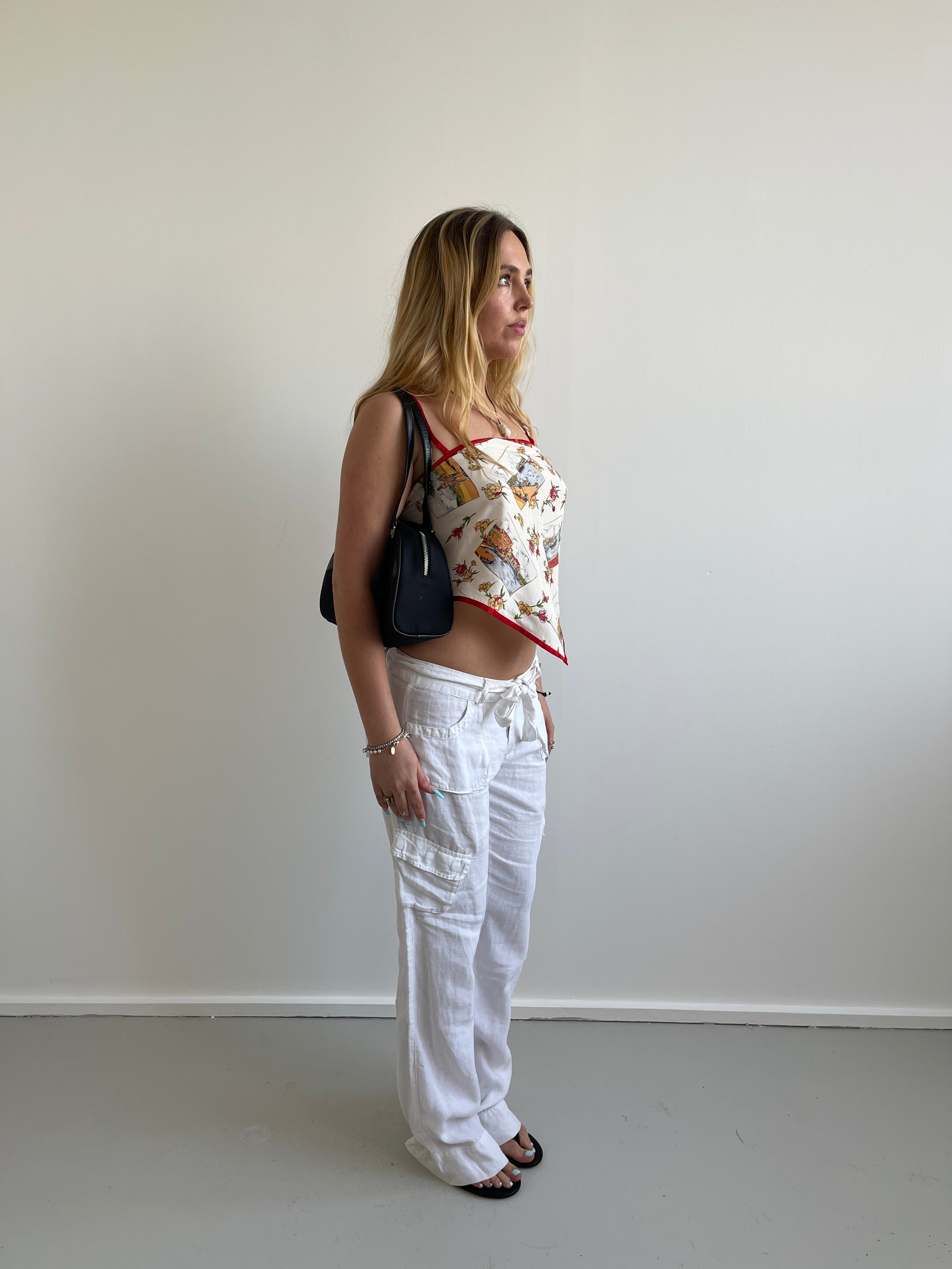 White linen trousers with belt and cargo style pockets