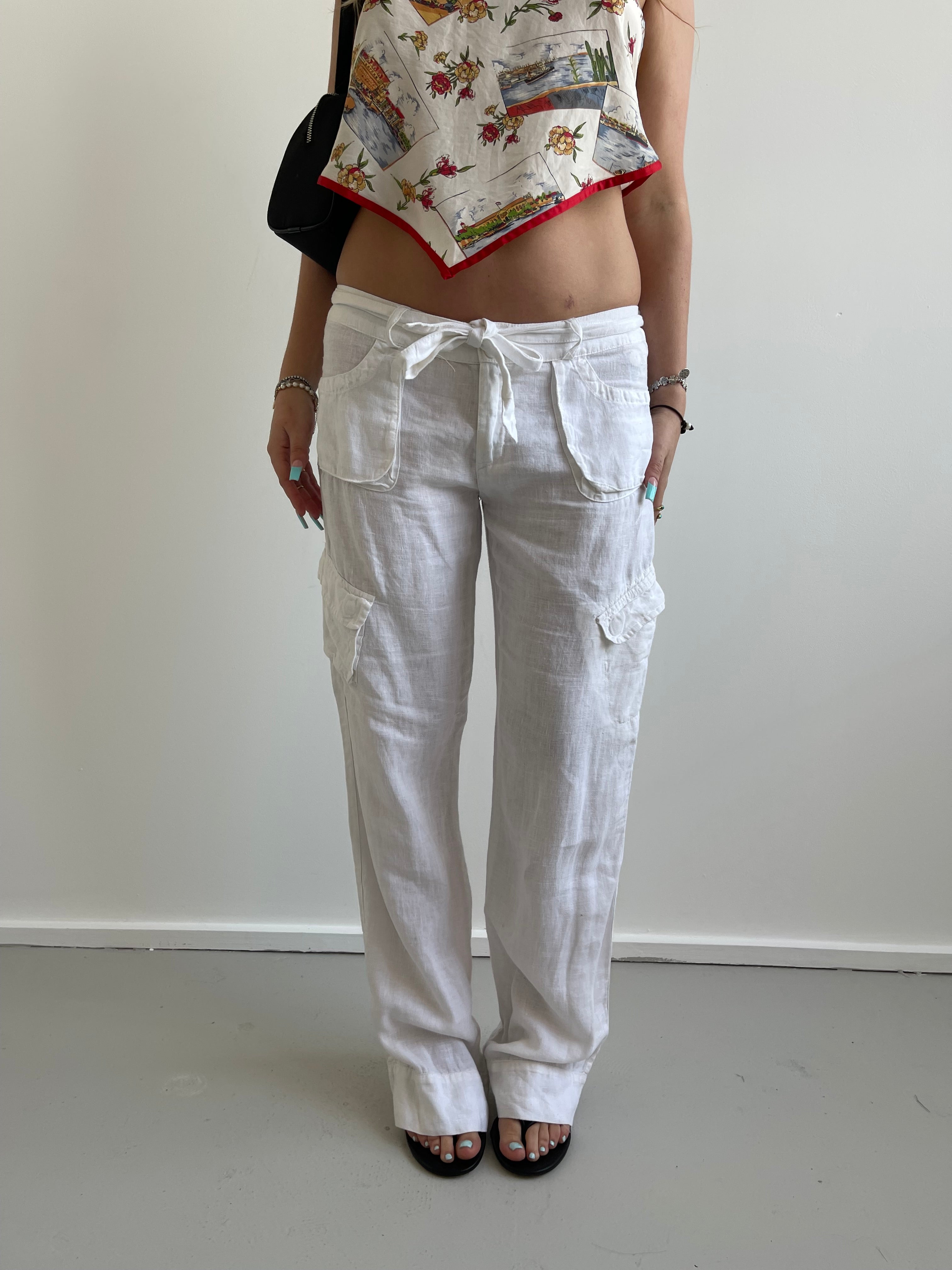 White linen trousers with belt and cargo style pockets