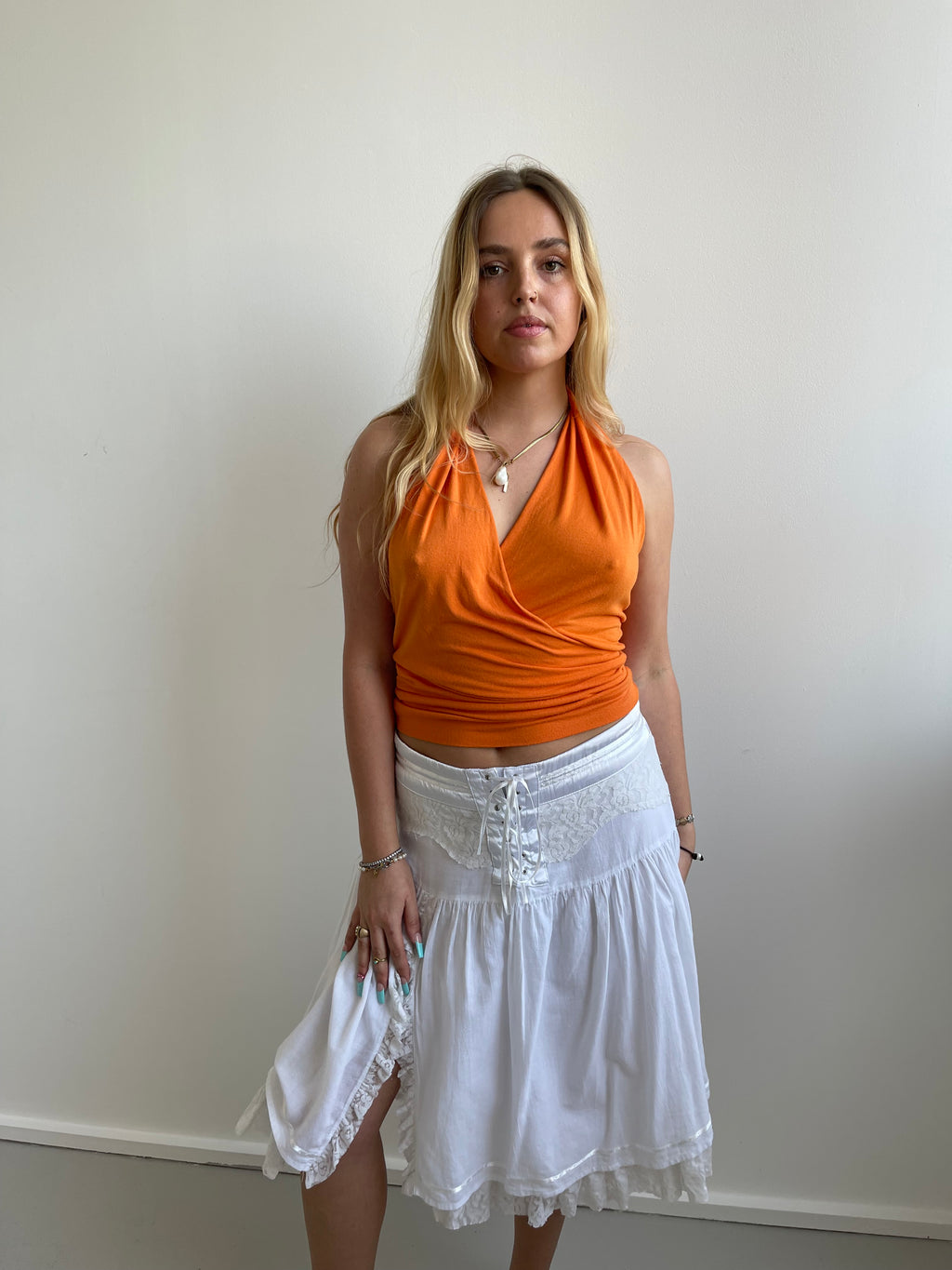 Orange plunge halter top