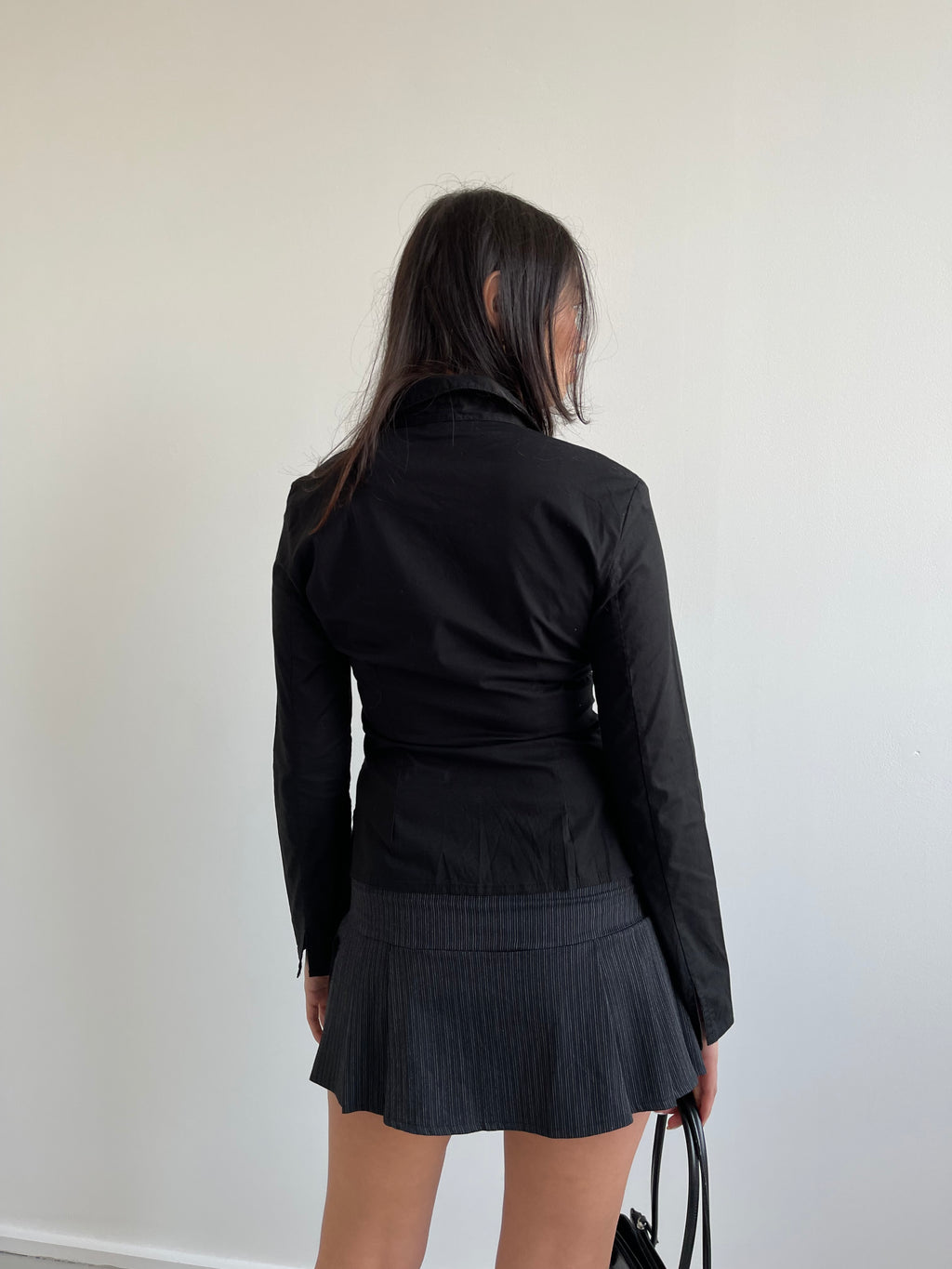 Black pleated mini skirt with grey pinstripe