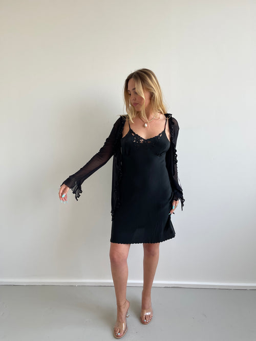 Black mesh cardigan with ruffle detail and satin trims