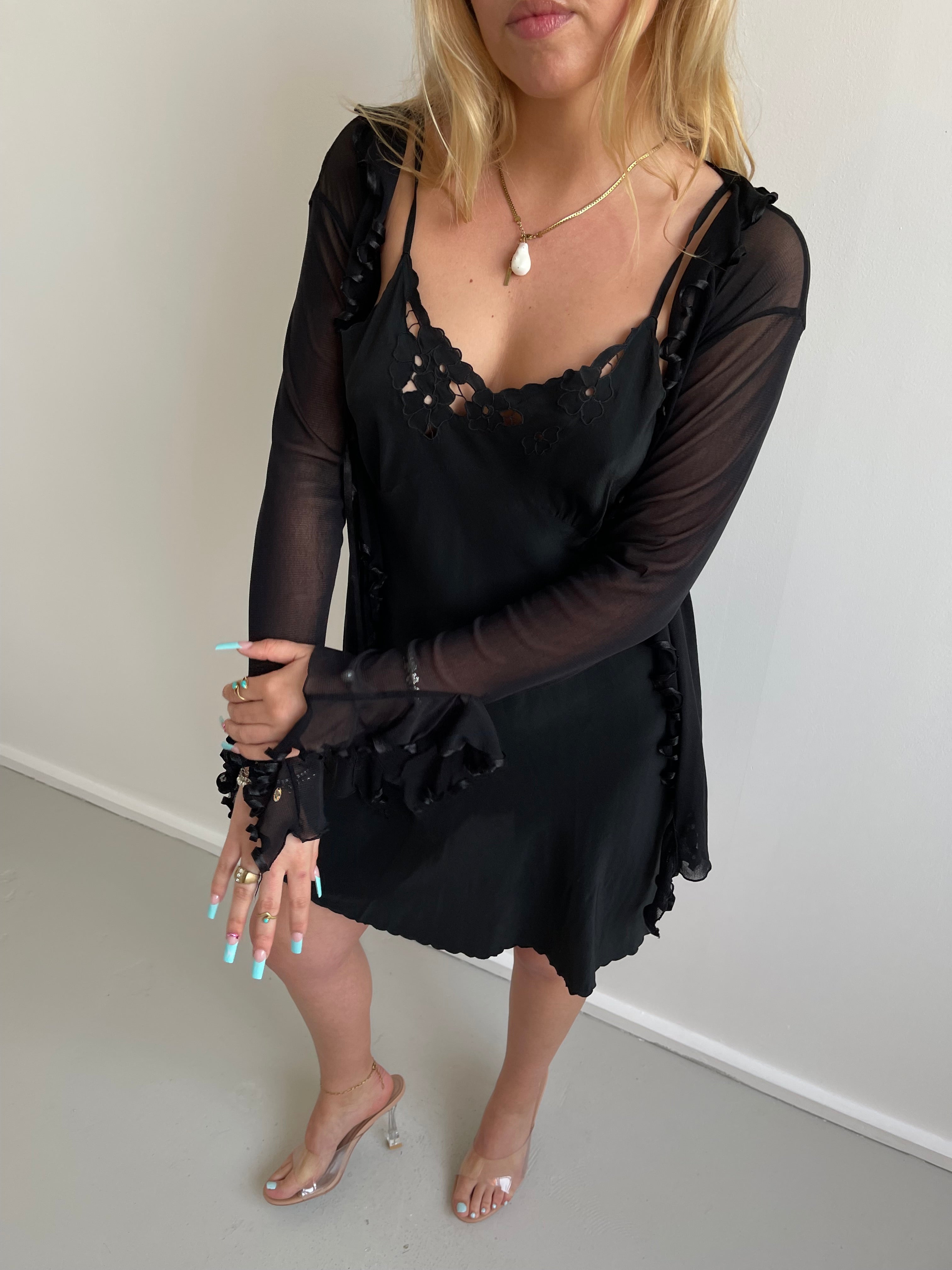 Black mesh cardigan with ruffle detail and satin trims