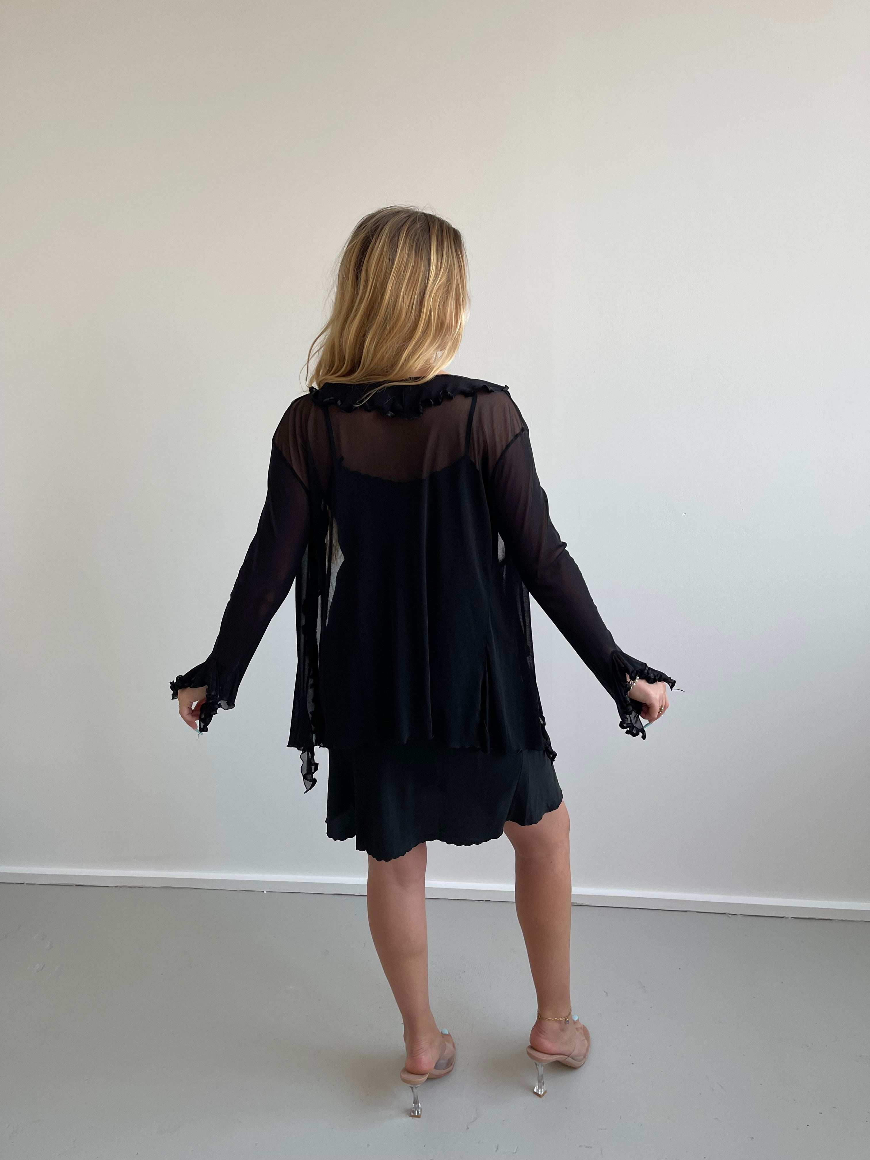 Black mesh cardigan with ruffle detail and satin trims