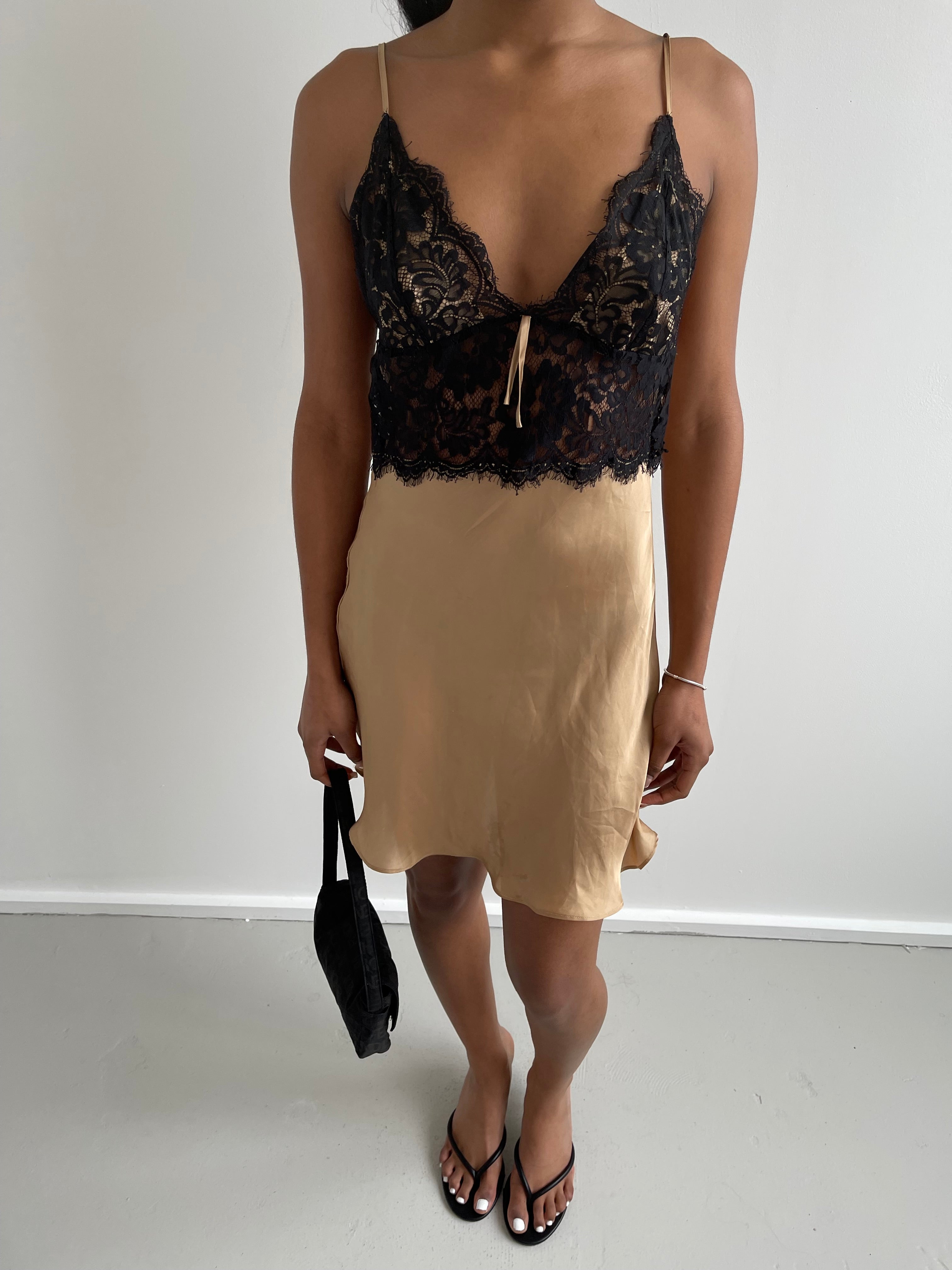 Gold satin slip dress with black lace detail