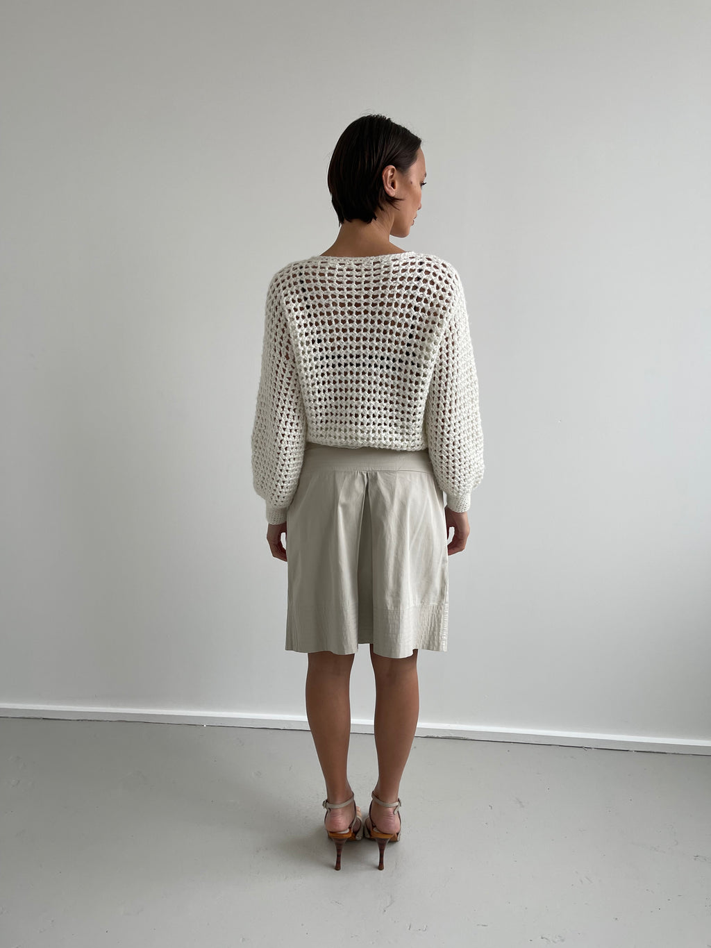 Beige pleated knee length shirt with top stitch trims