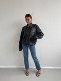 Oversized black leather bomber jacket