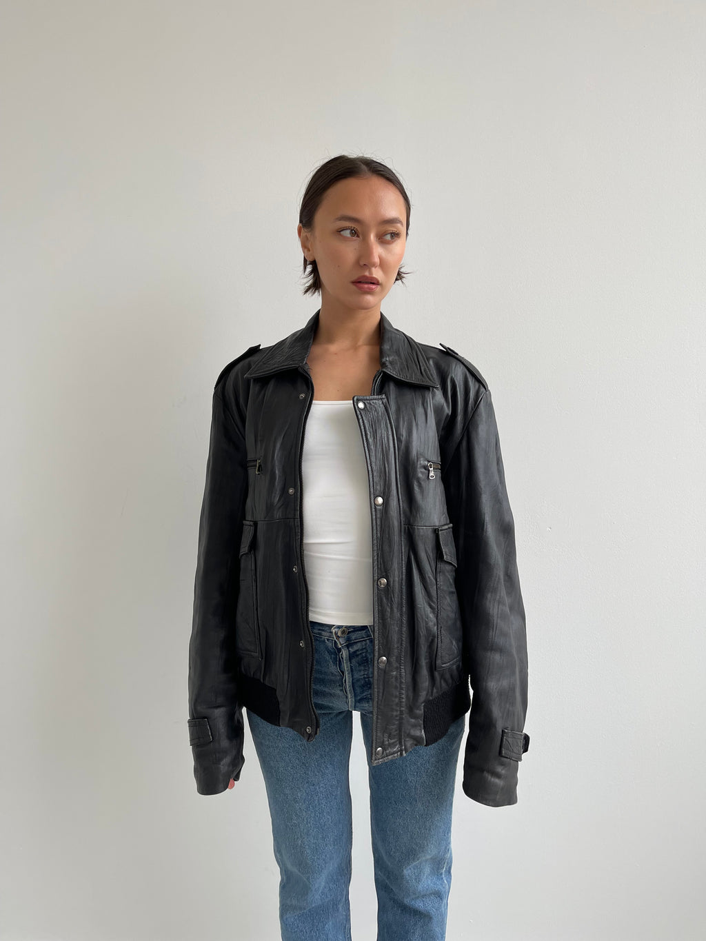Oversized black leather bomber jacket