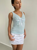 Baby blue cami top with white trims