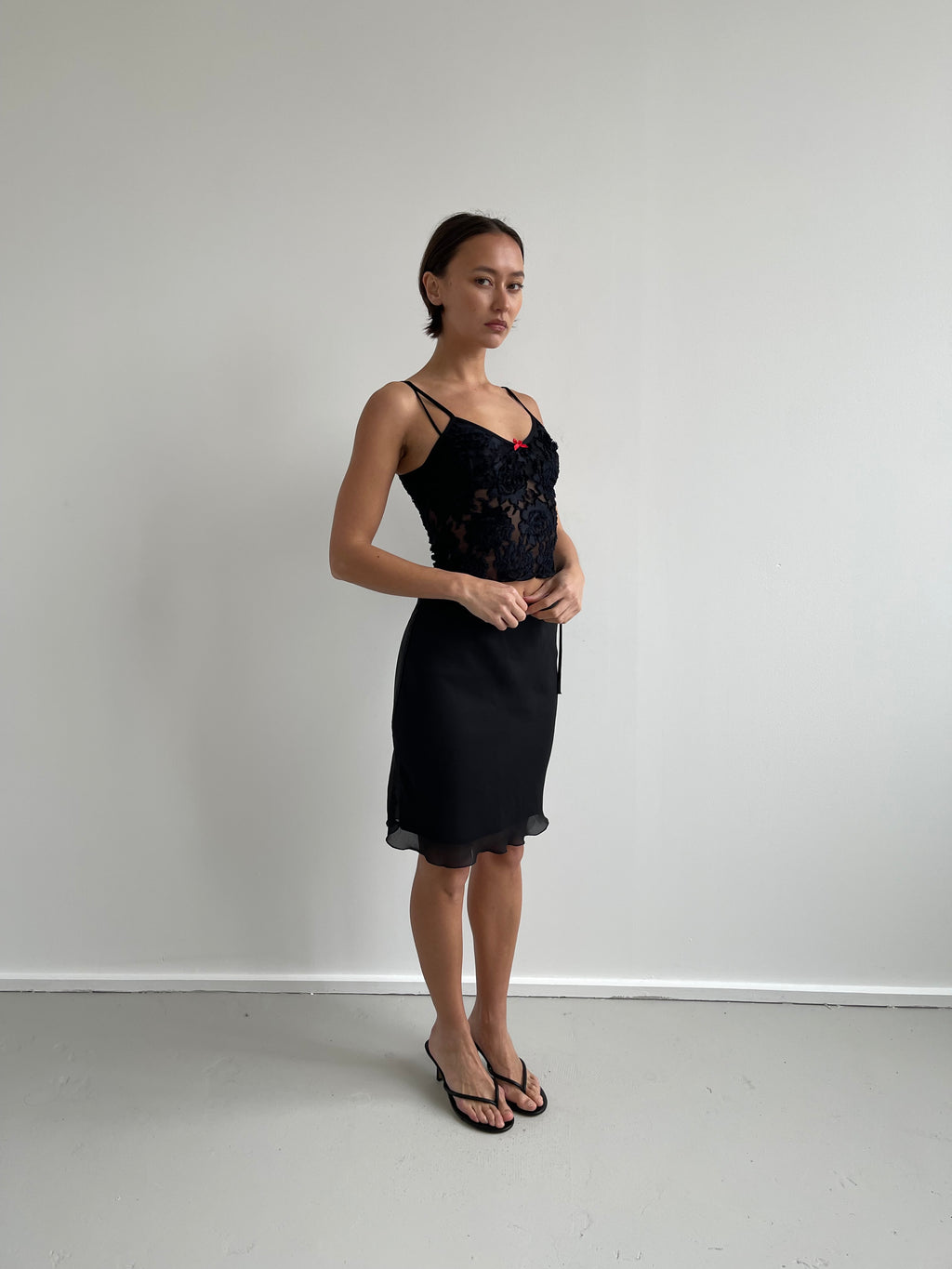 Black semi sheer cami top with red bow