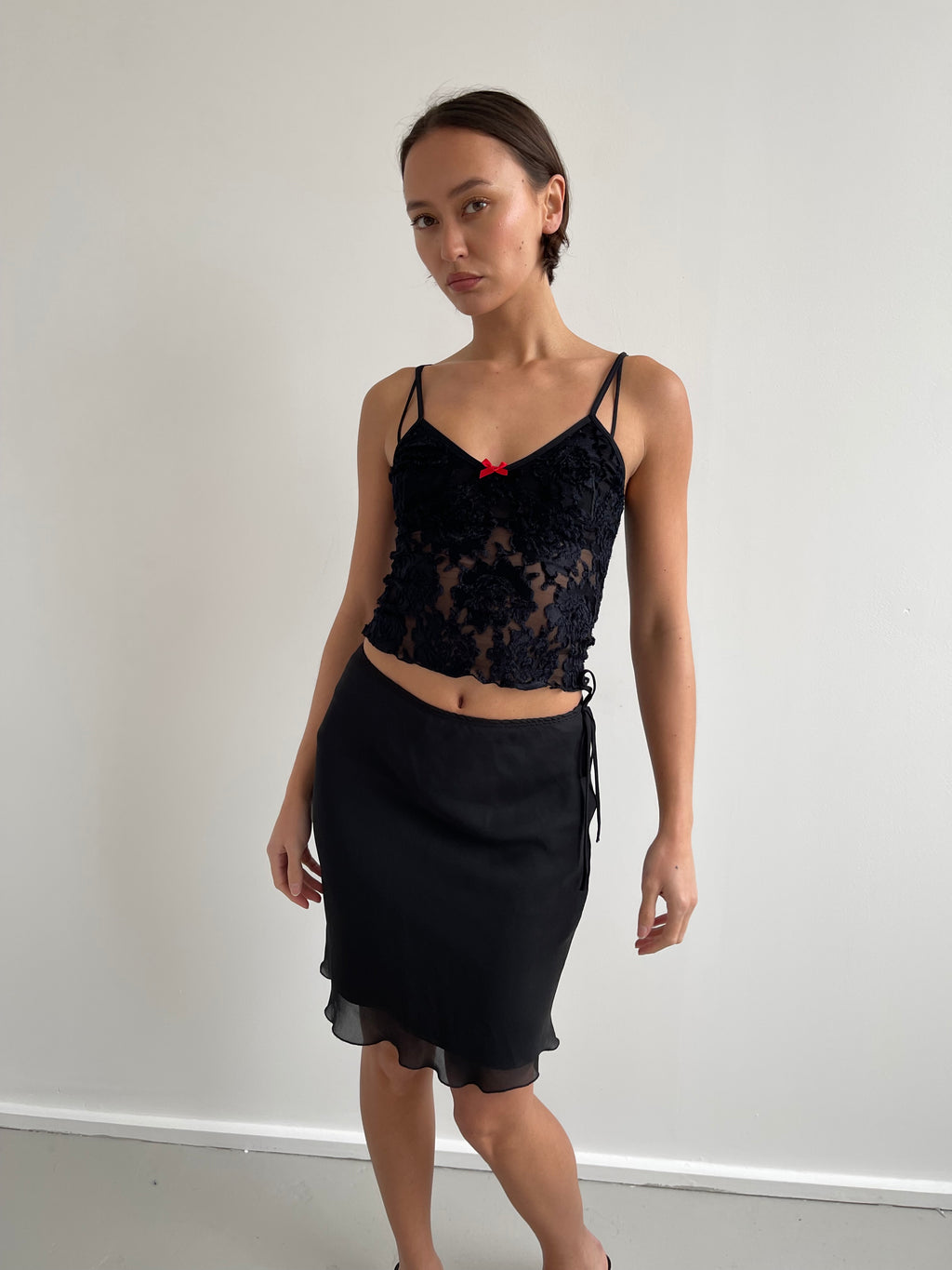 Black semi sheer cami top with red bow