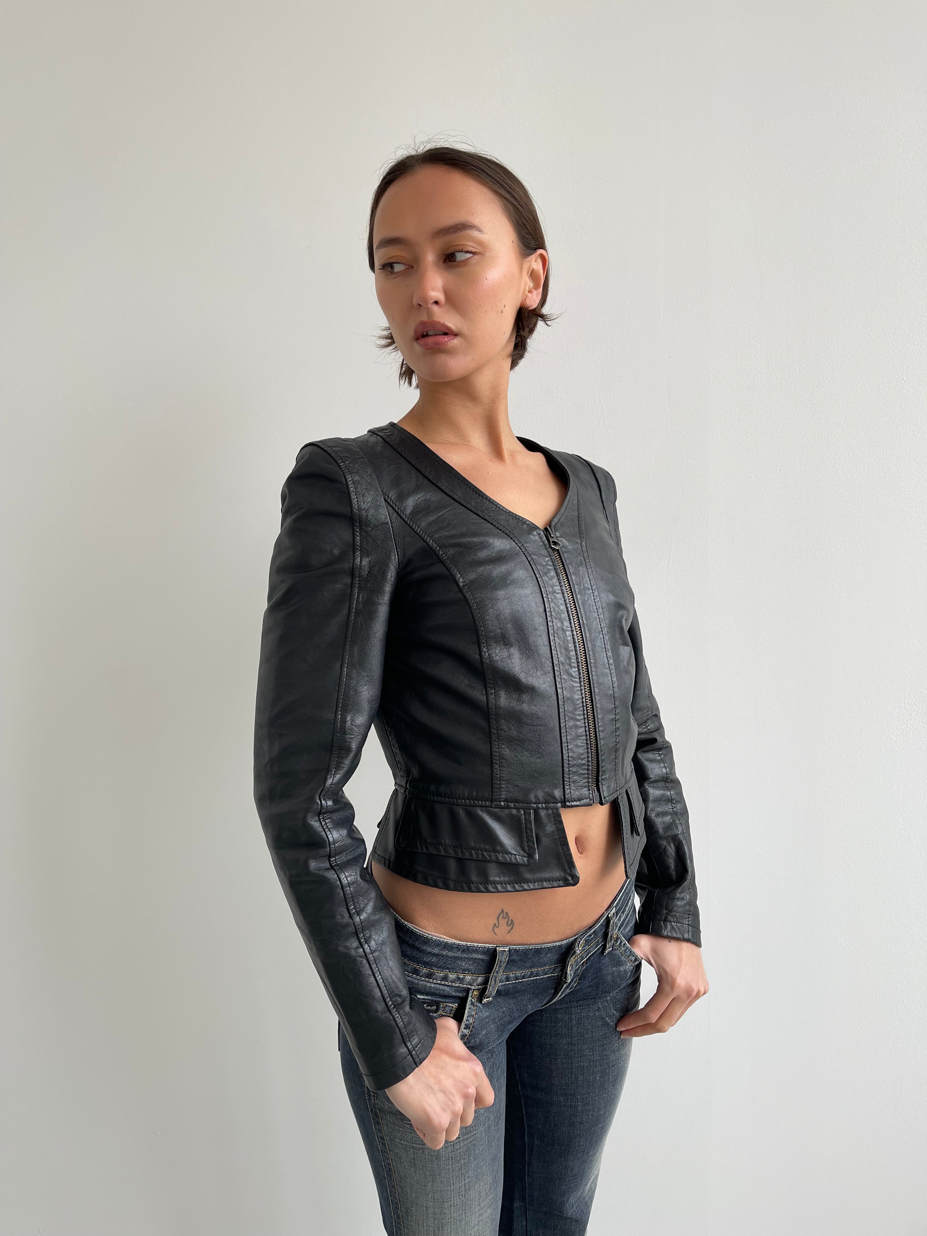Fitted black leather jacket with panels and low cut neck