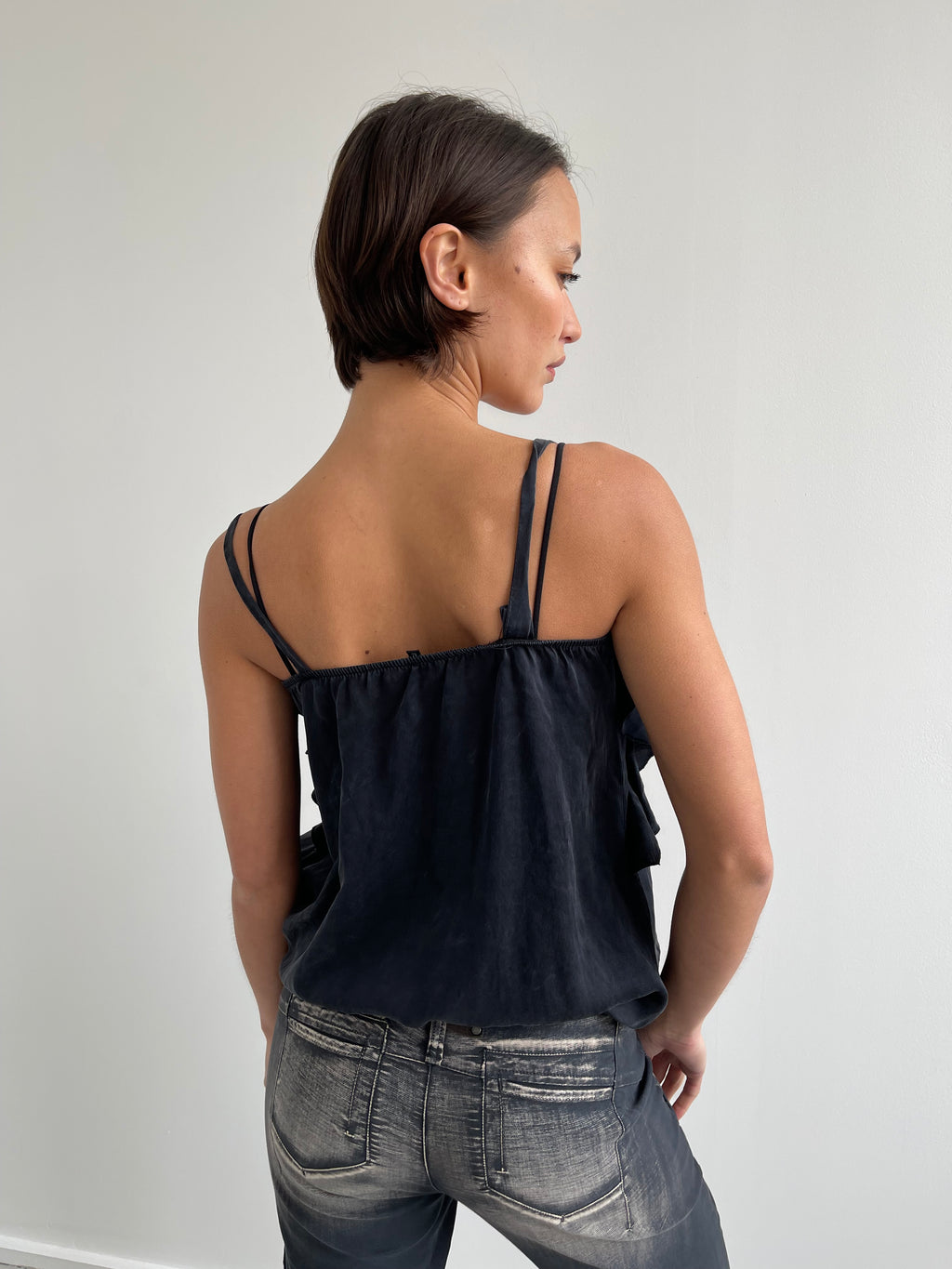 Black silk flowy blouse with ruffles and side tie