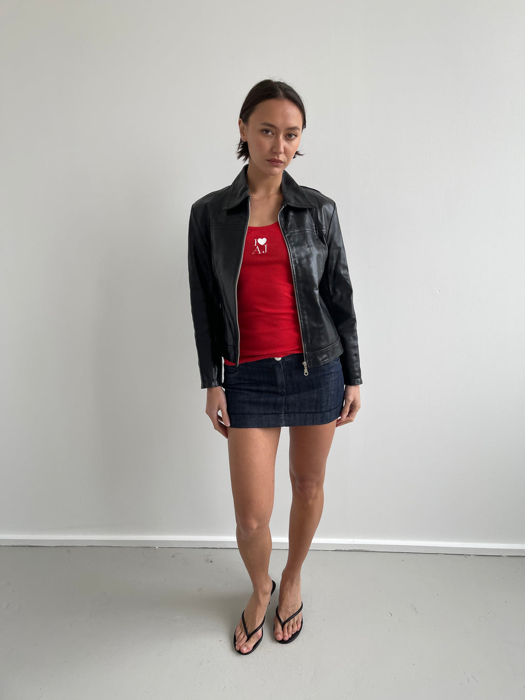Black leather jacket with labelled detail
