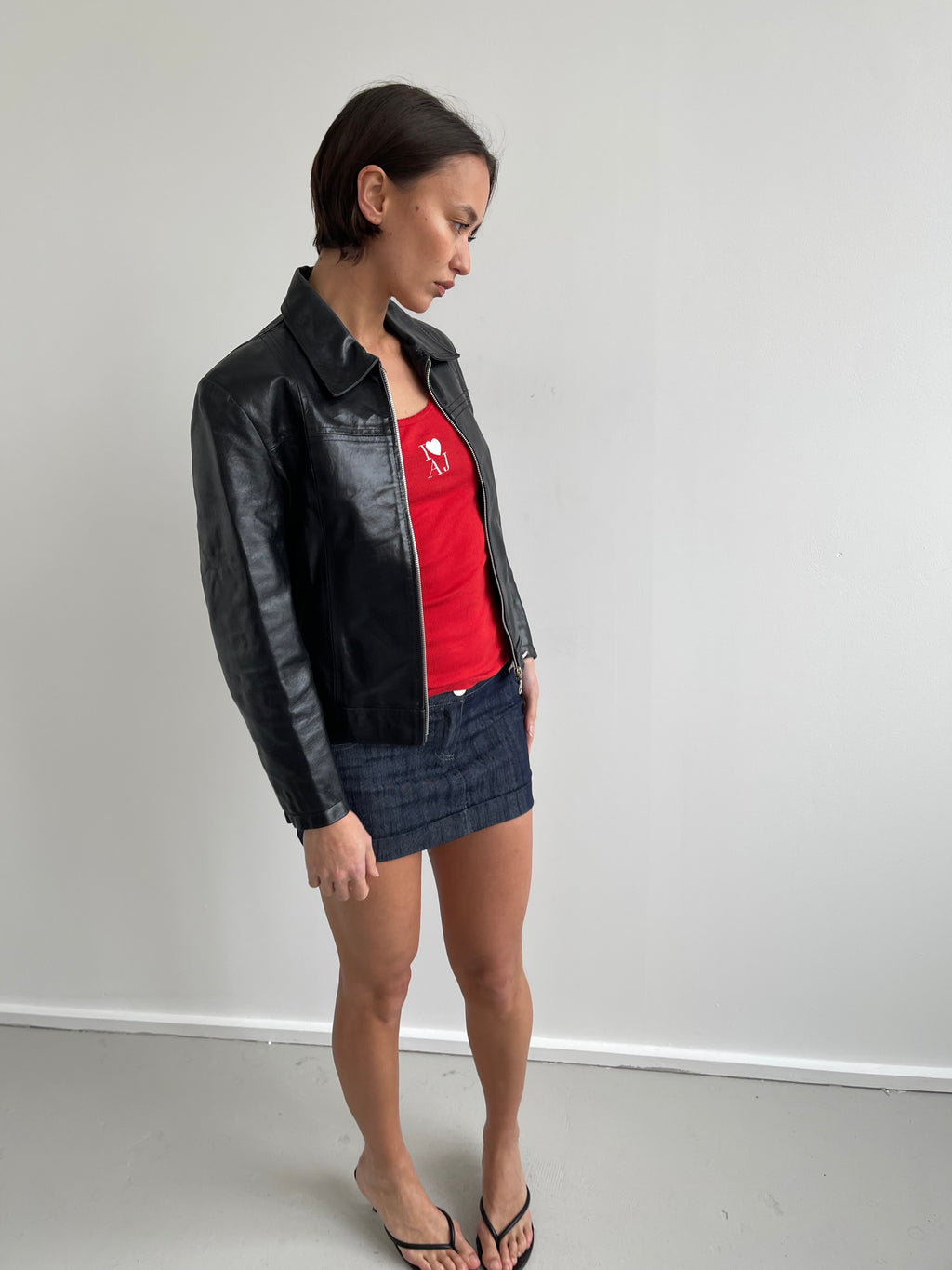 Black leather jacket with labelled detail