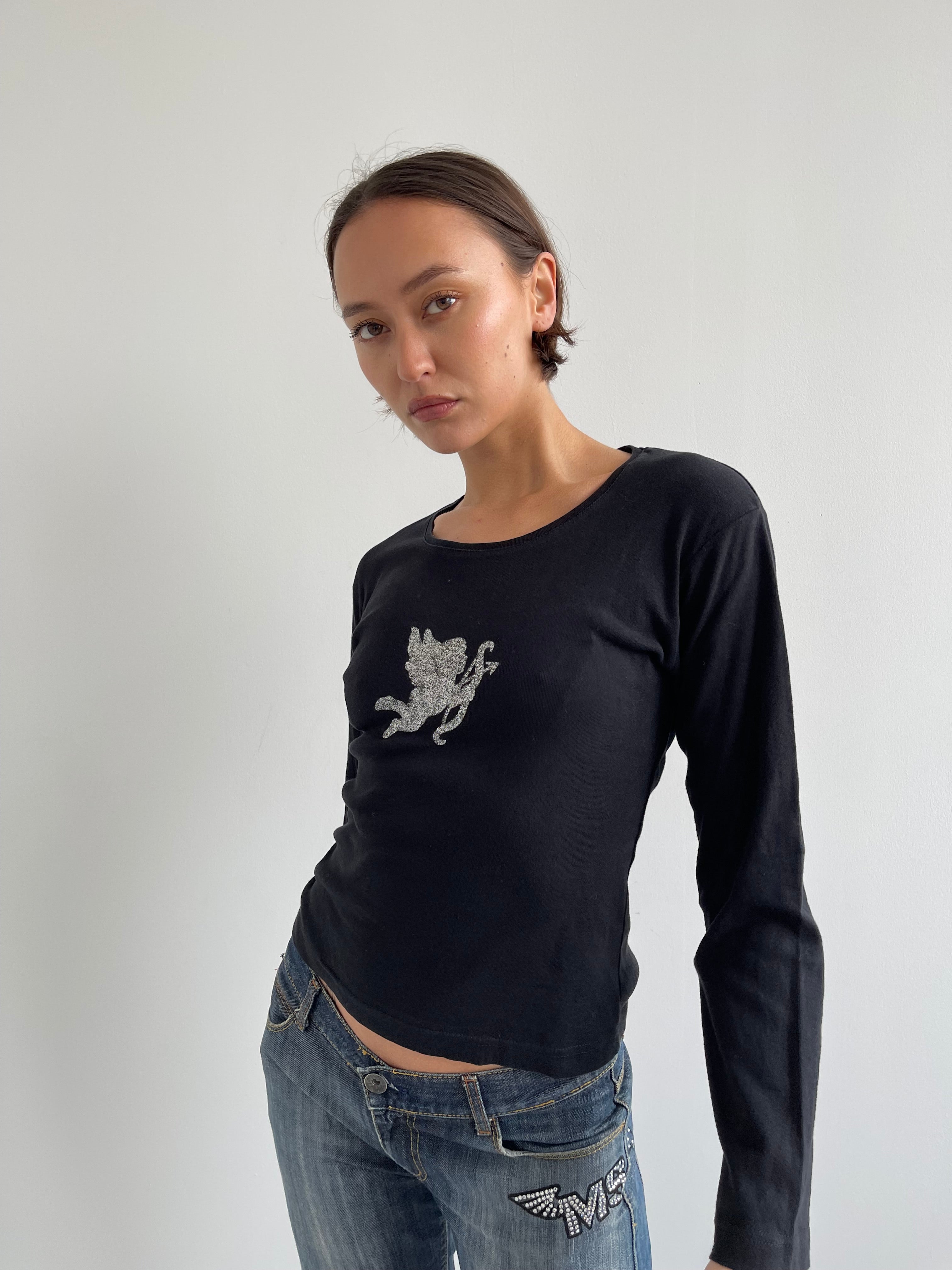 Black long sleeved top with silver cherub
