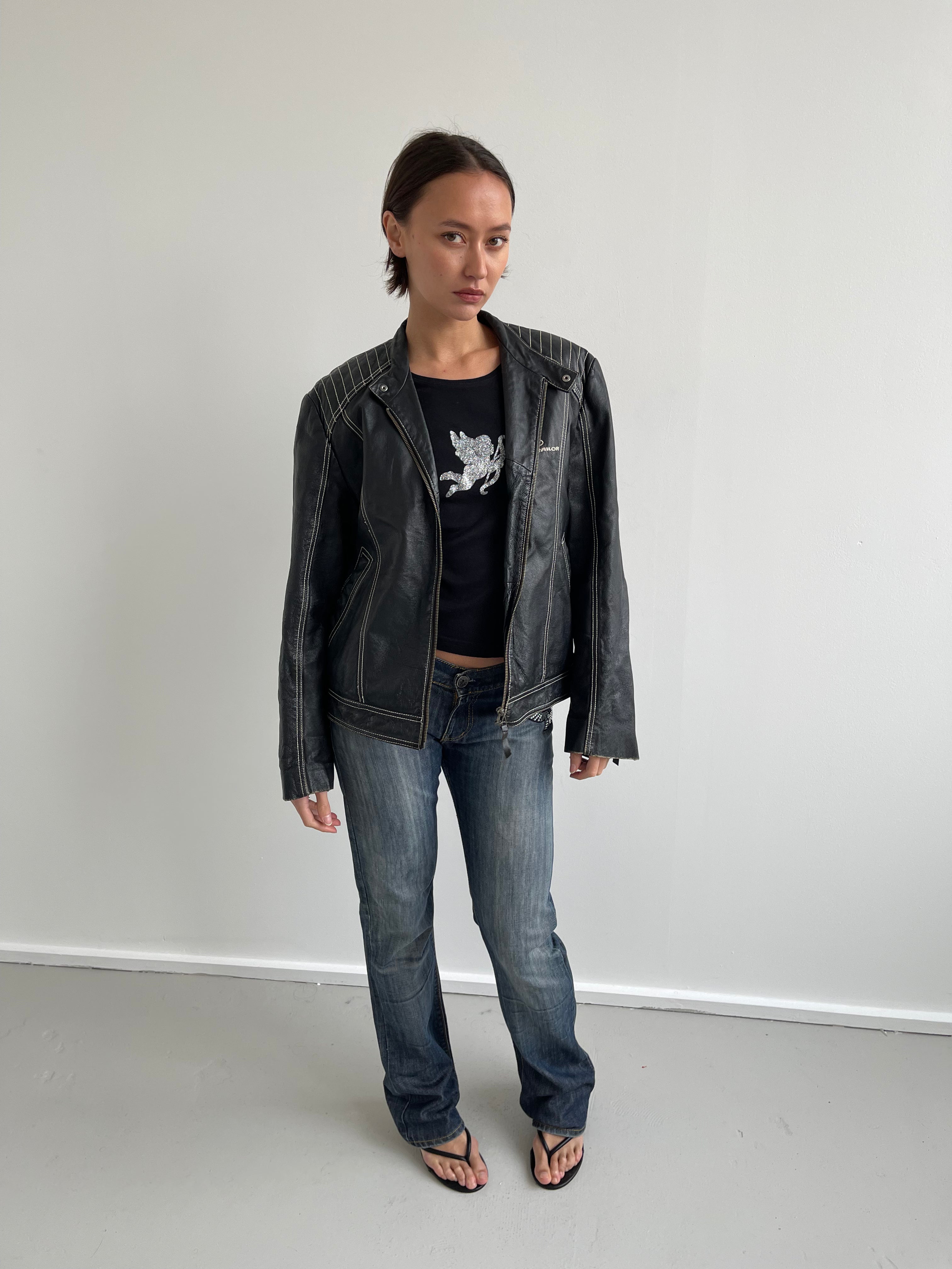 Black long sleeved top with silver cherub