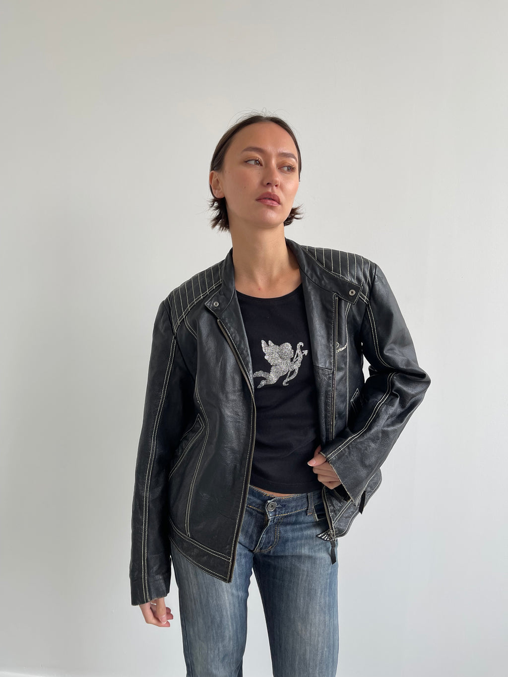 Vintage black leather biker jacket with cream top stitching