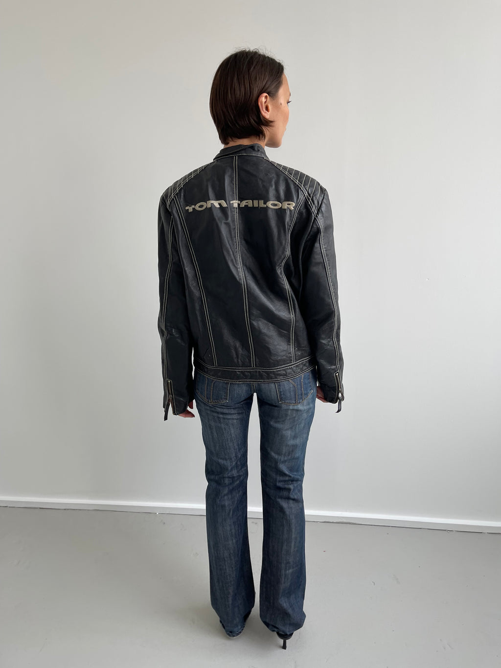 Vintage black leather biker jacket with cream top stitching