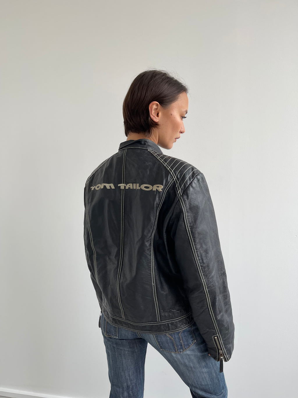 Vintage black leather biker jacket with cream top stitching