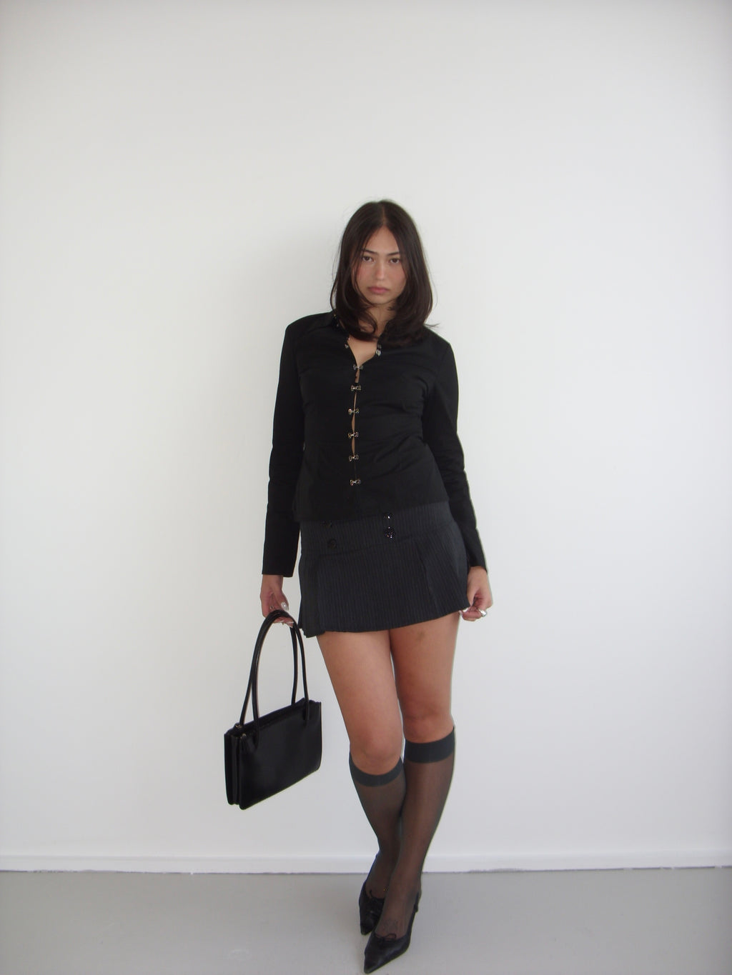 Black pleated mini skirt with grey pinstripe