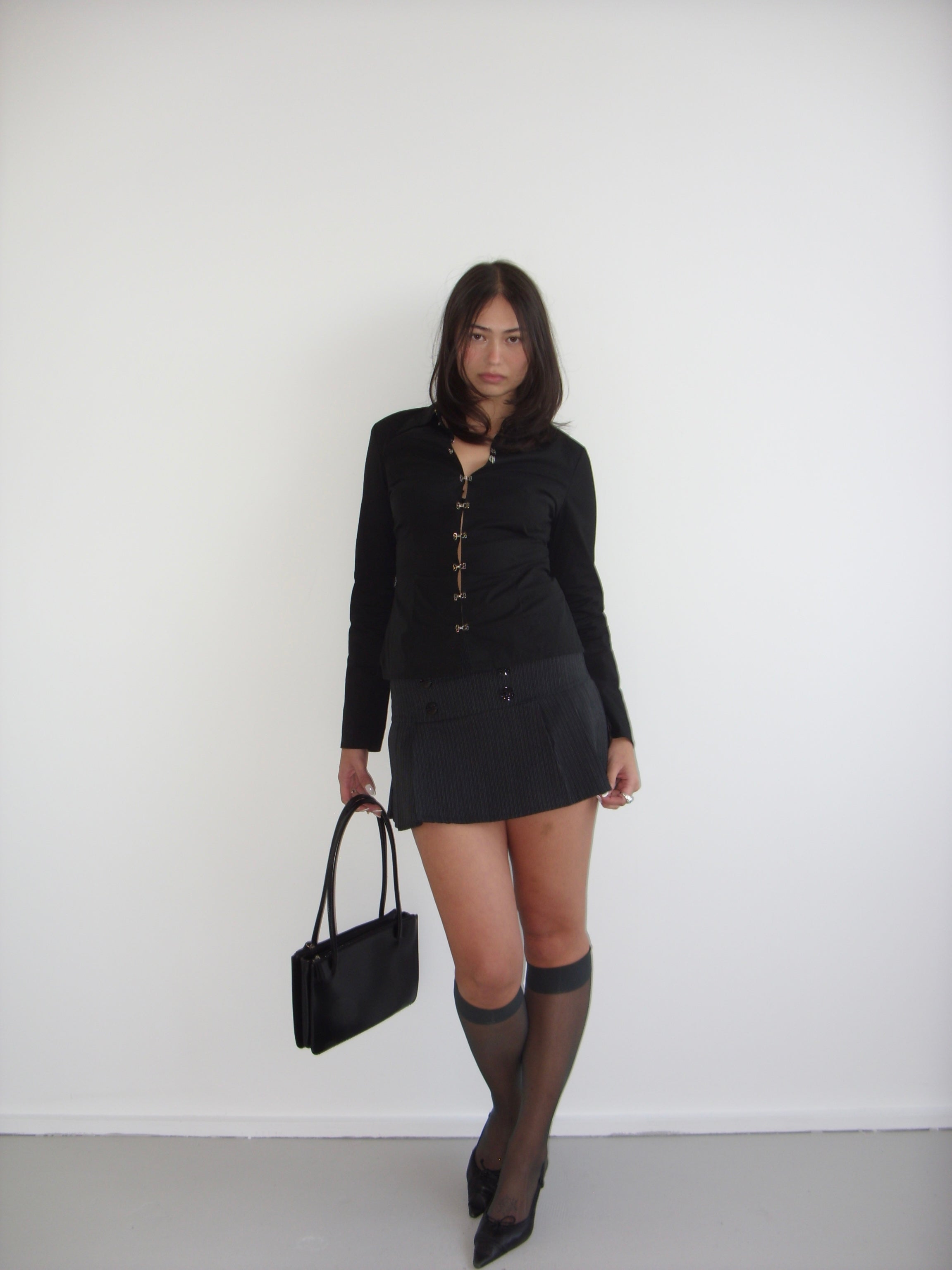 Black pleated mini skirt with grey pinstripe