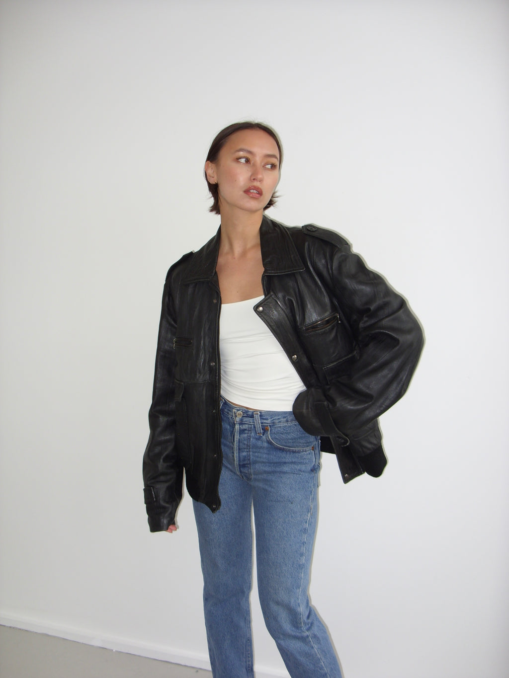 Oversized black leather bomber jacket