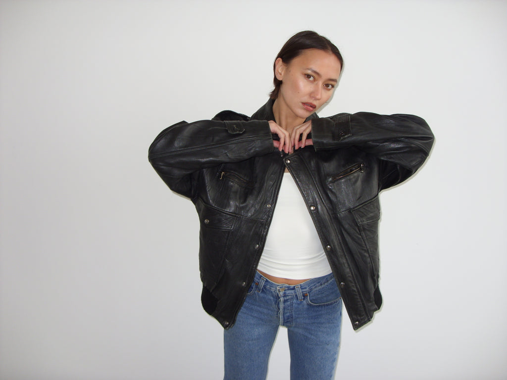 Oversized black leather bomber jacket