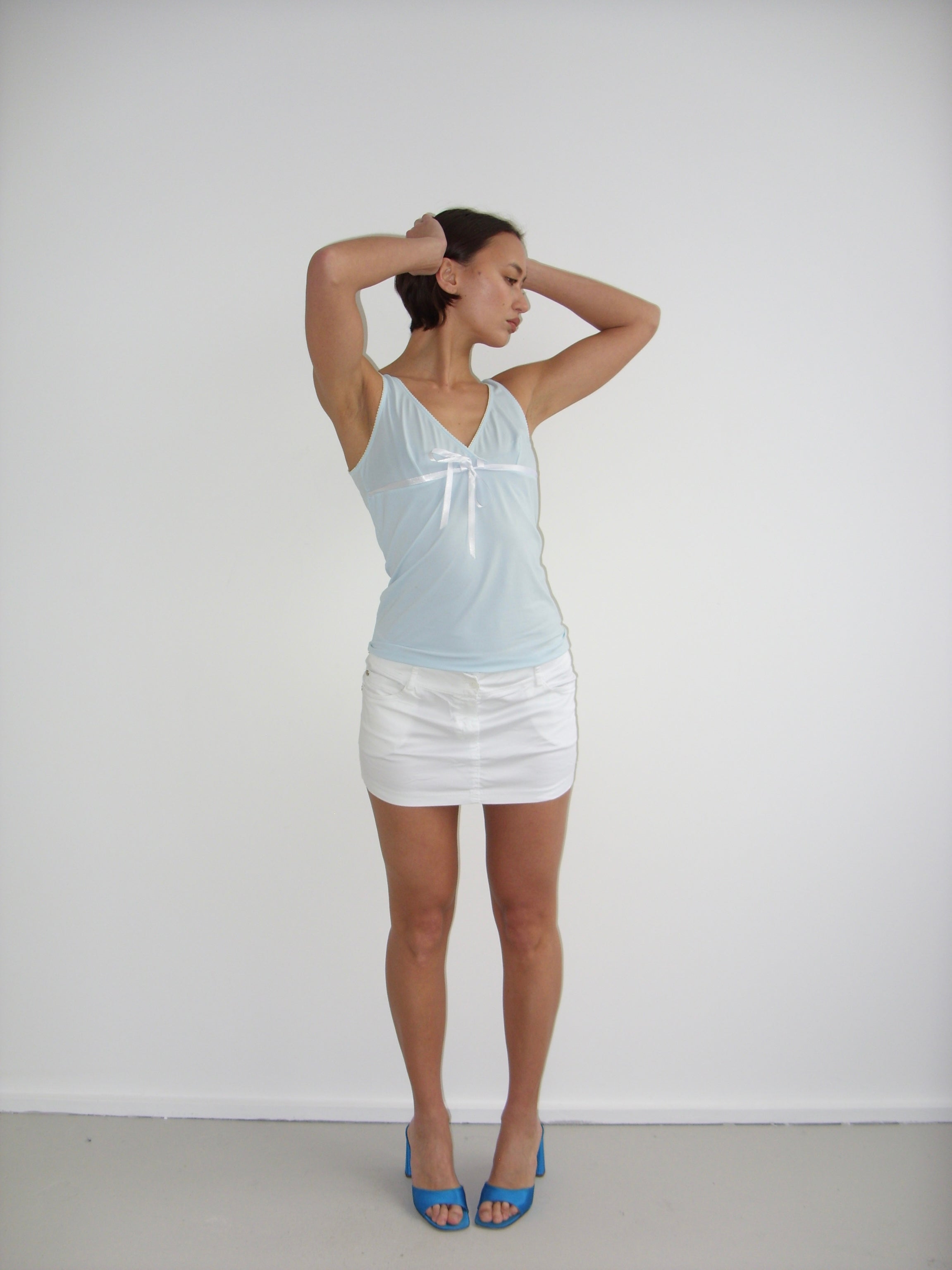 Baby blue cami top with white trims